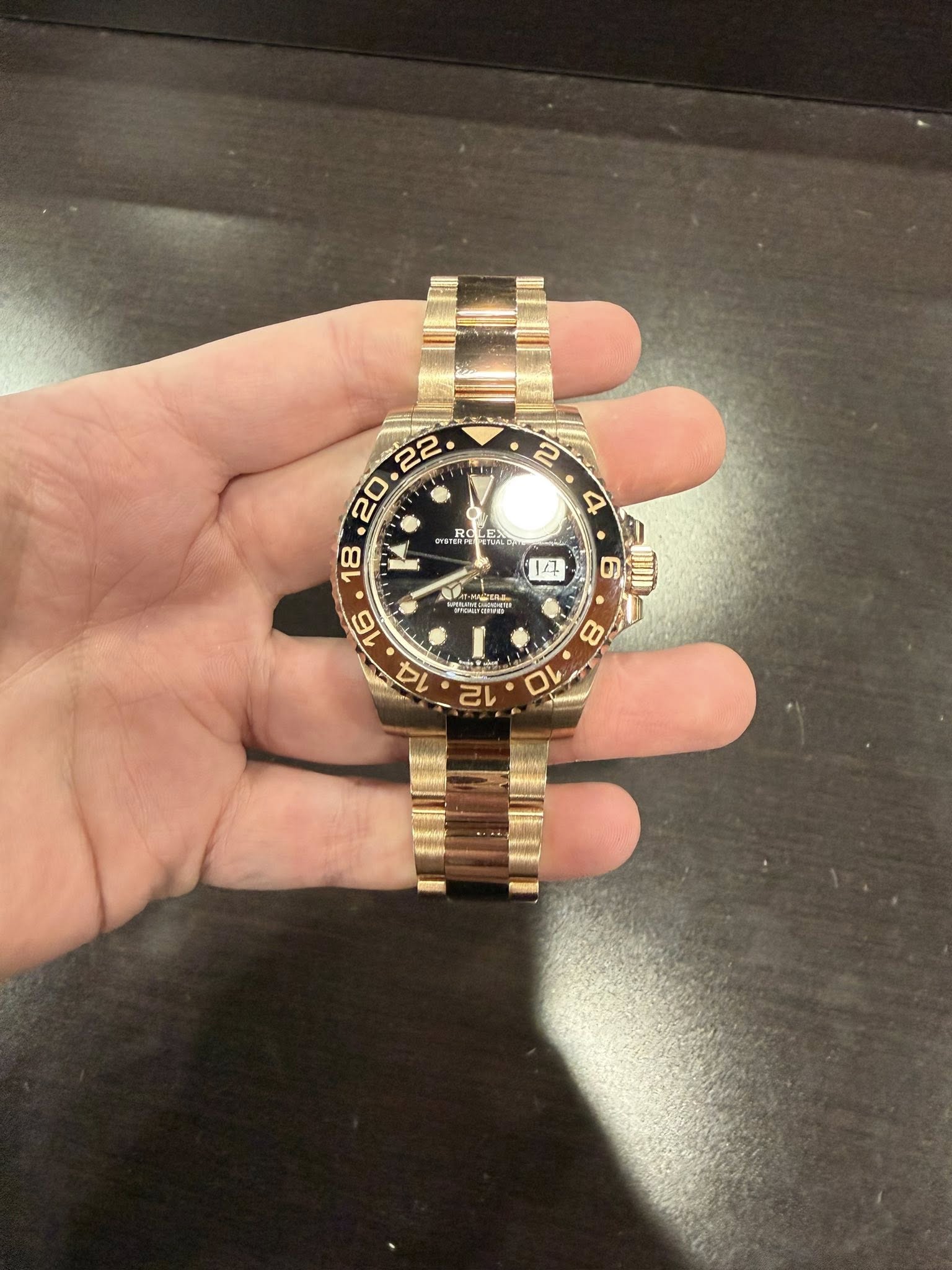 May be an image of wrist watch and text