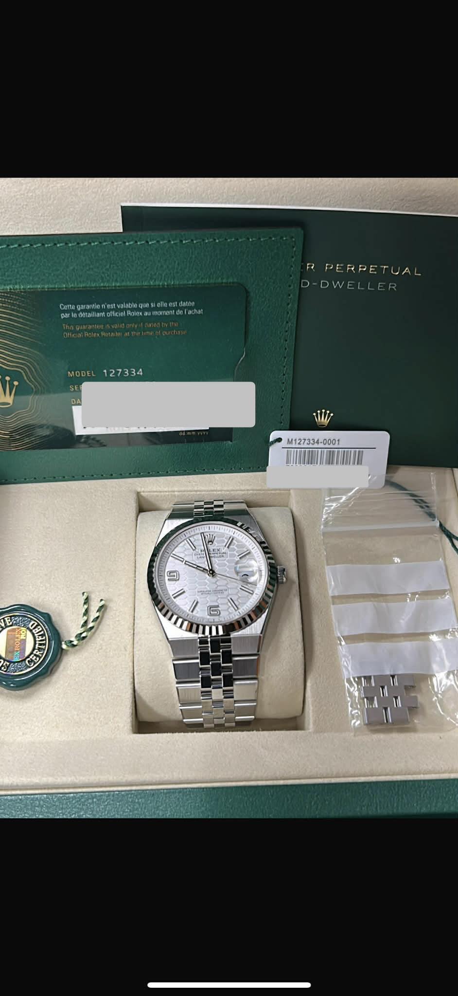 May be an image of wrist watch and text