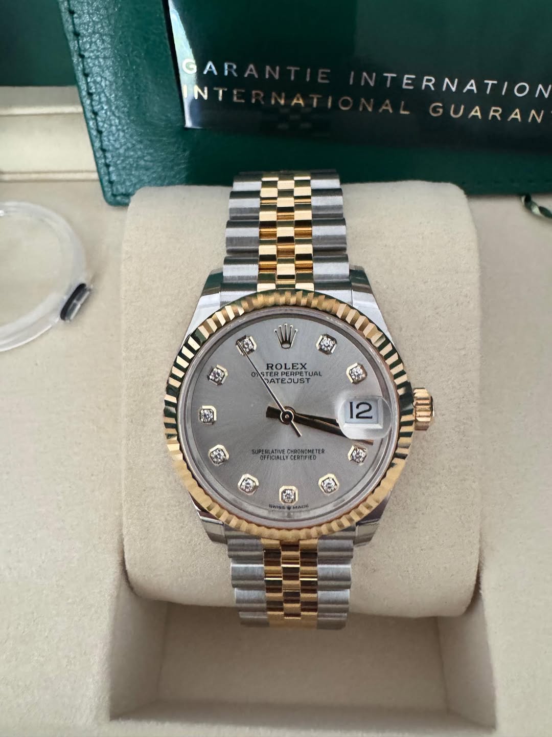 May be an image of wrist watch and text