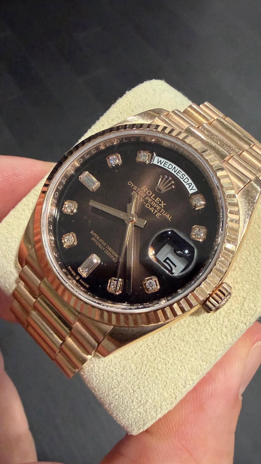 May be an image of wrist watch and text