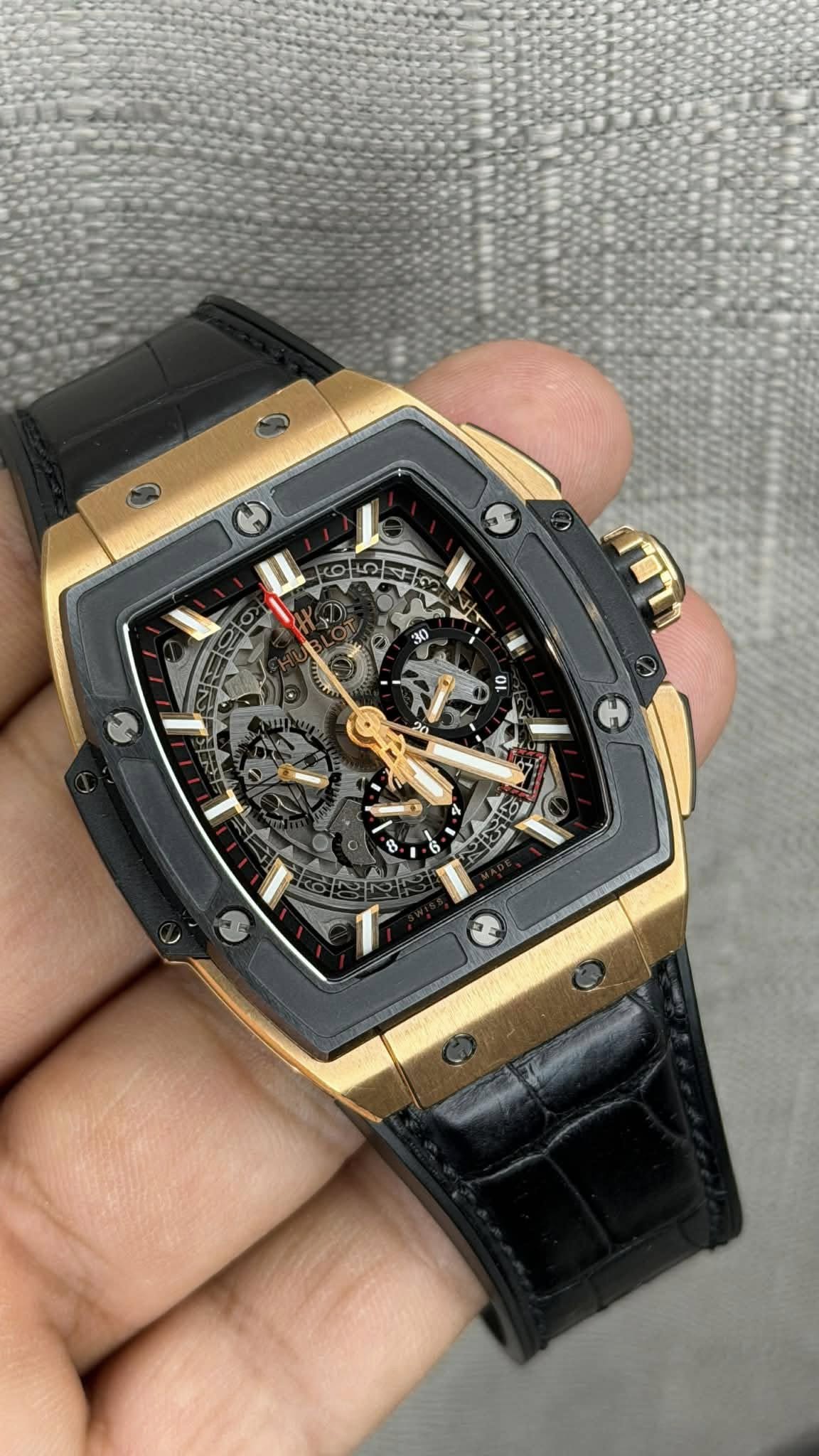 May be an image of wrist watch and text