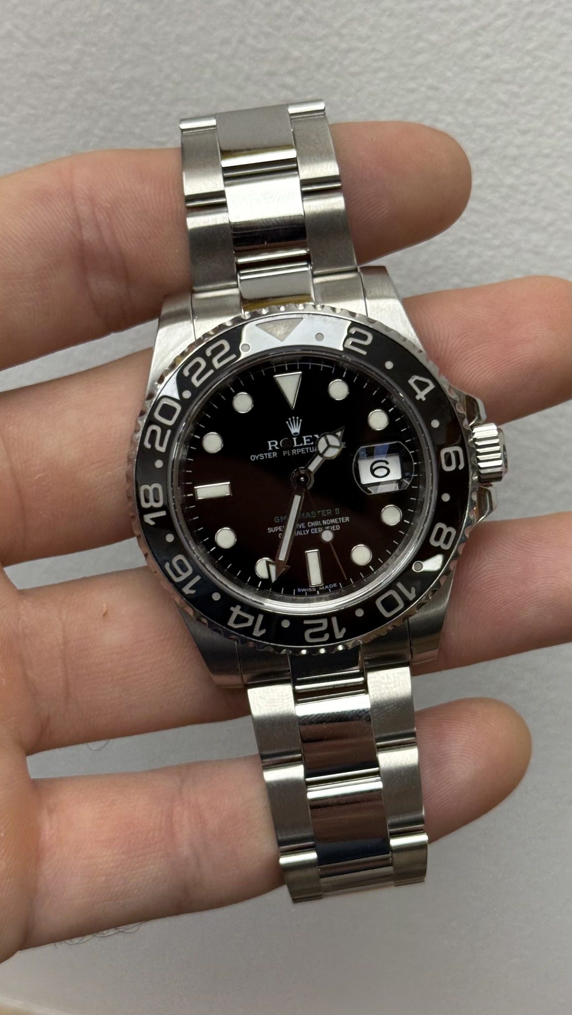 May be an image of wrist watch and text