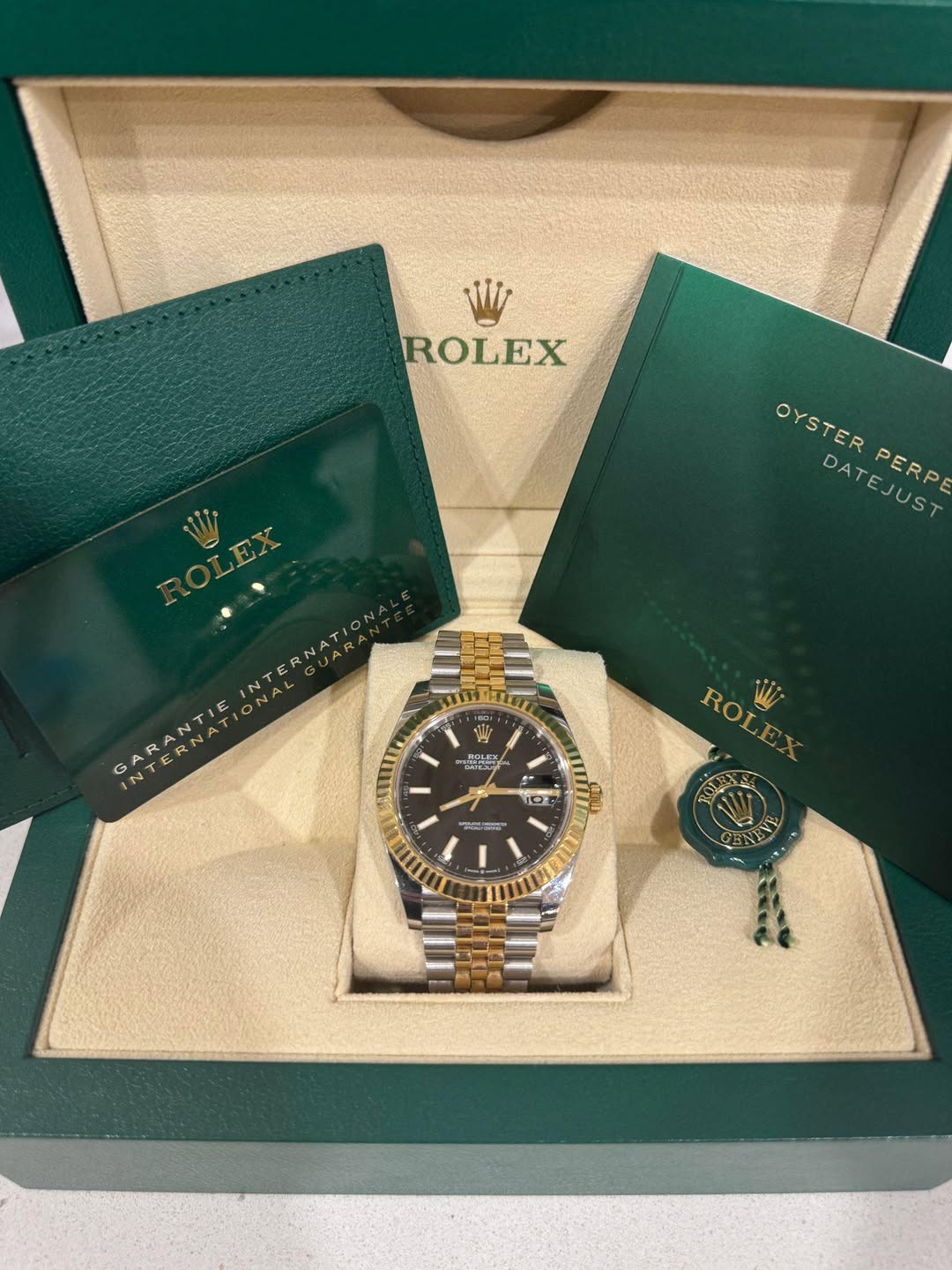 May be an image of wrist watch and text