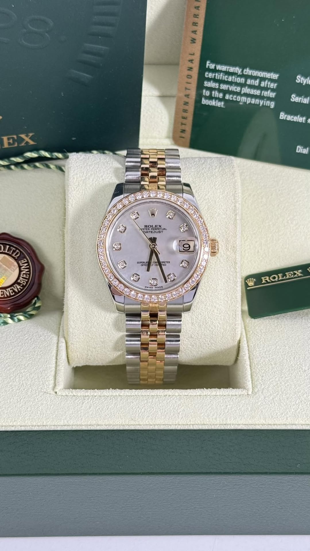 May be an image of wrist watch and text that says 'WARRA For warranty, chronometer sales ervice please certification and after Styl 1 to the booklet. accompanying refer Serial…