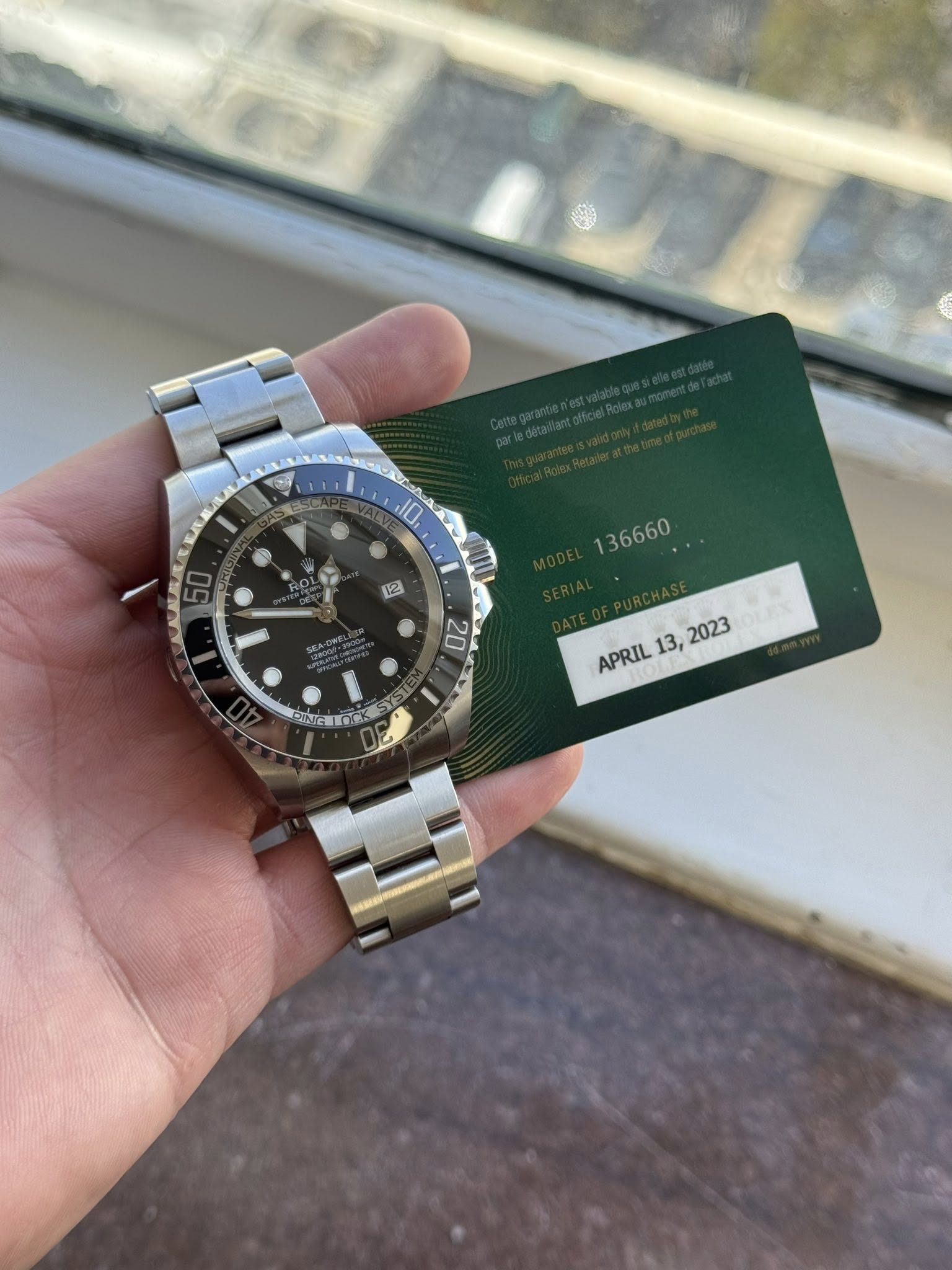 May be an image of wrist watch and text