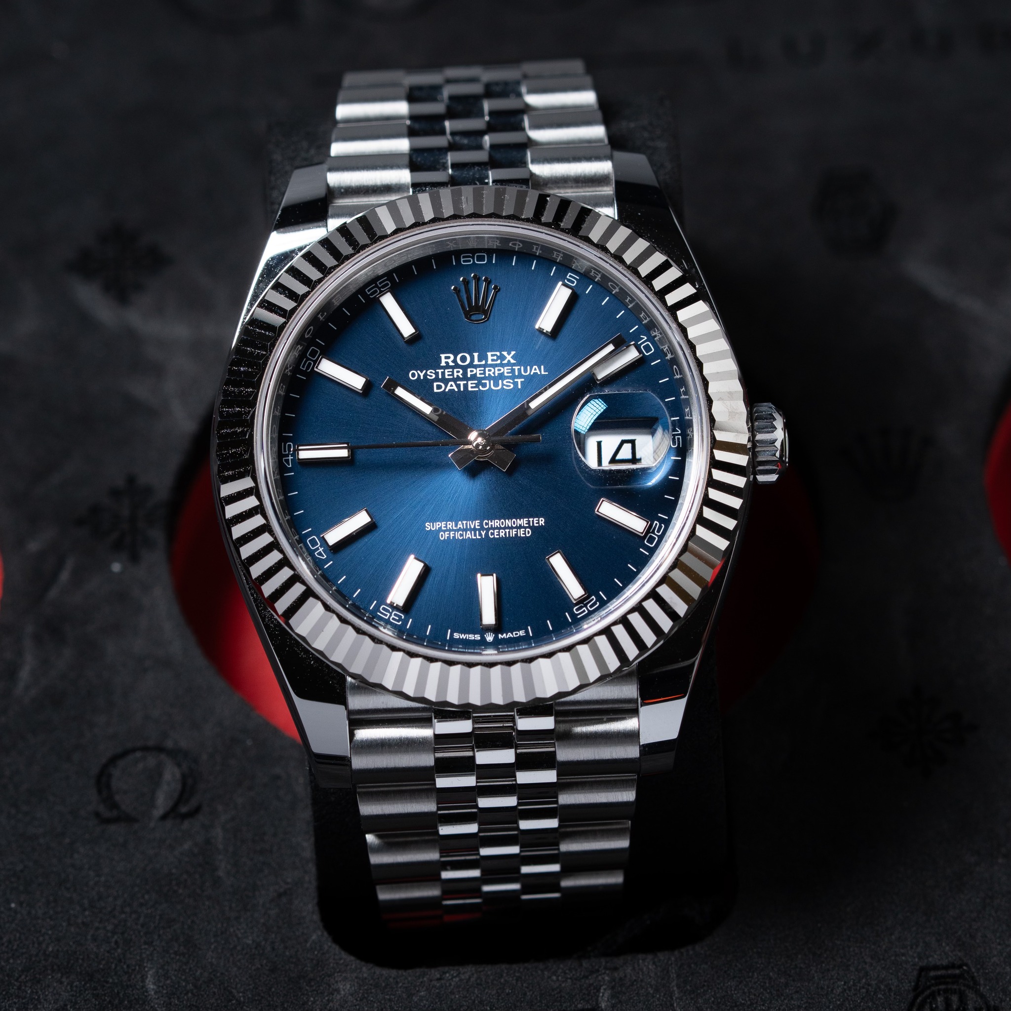May be an image of wrist watch and text