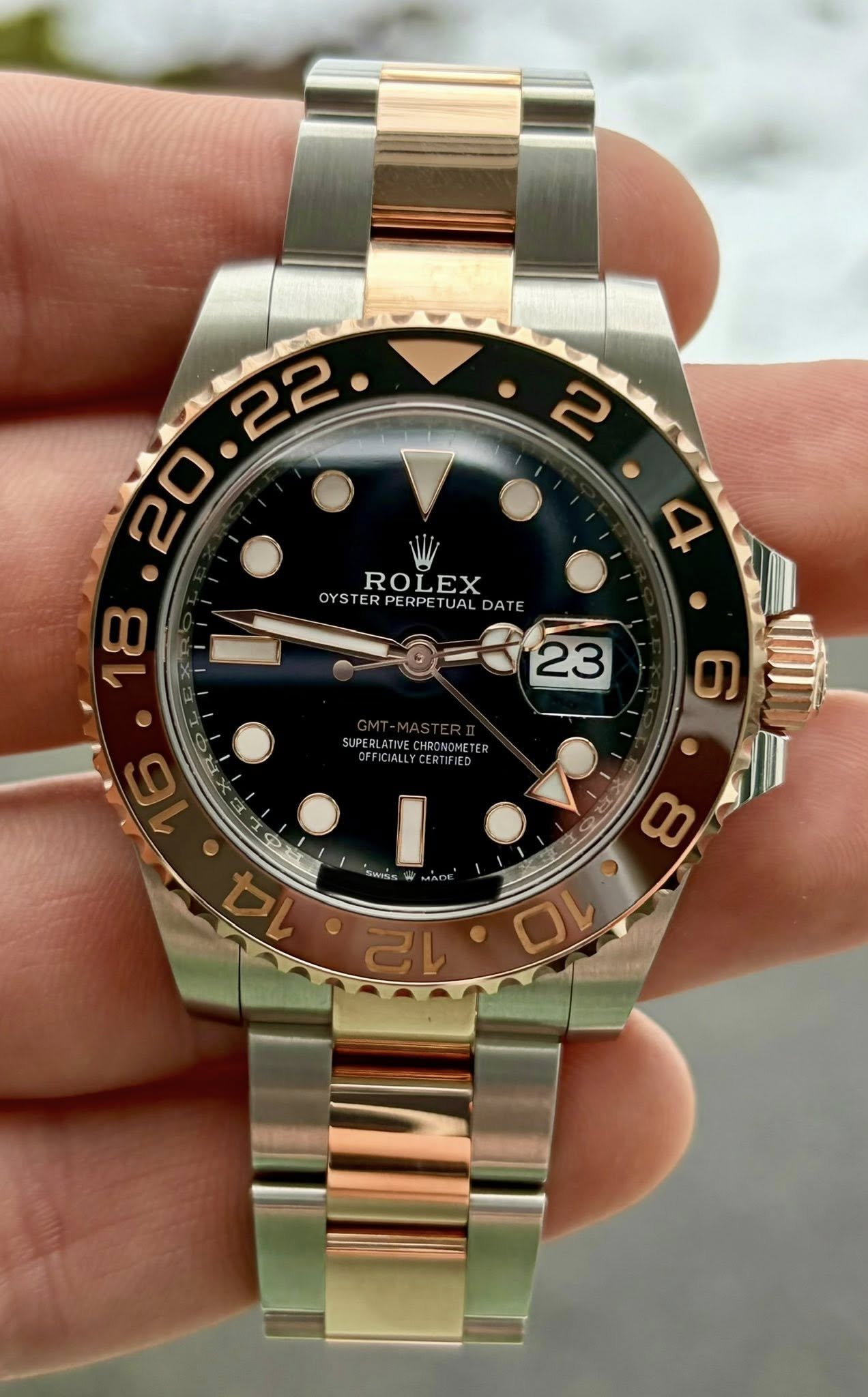 May be an image of wrist watch and text