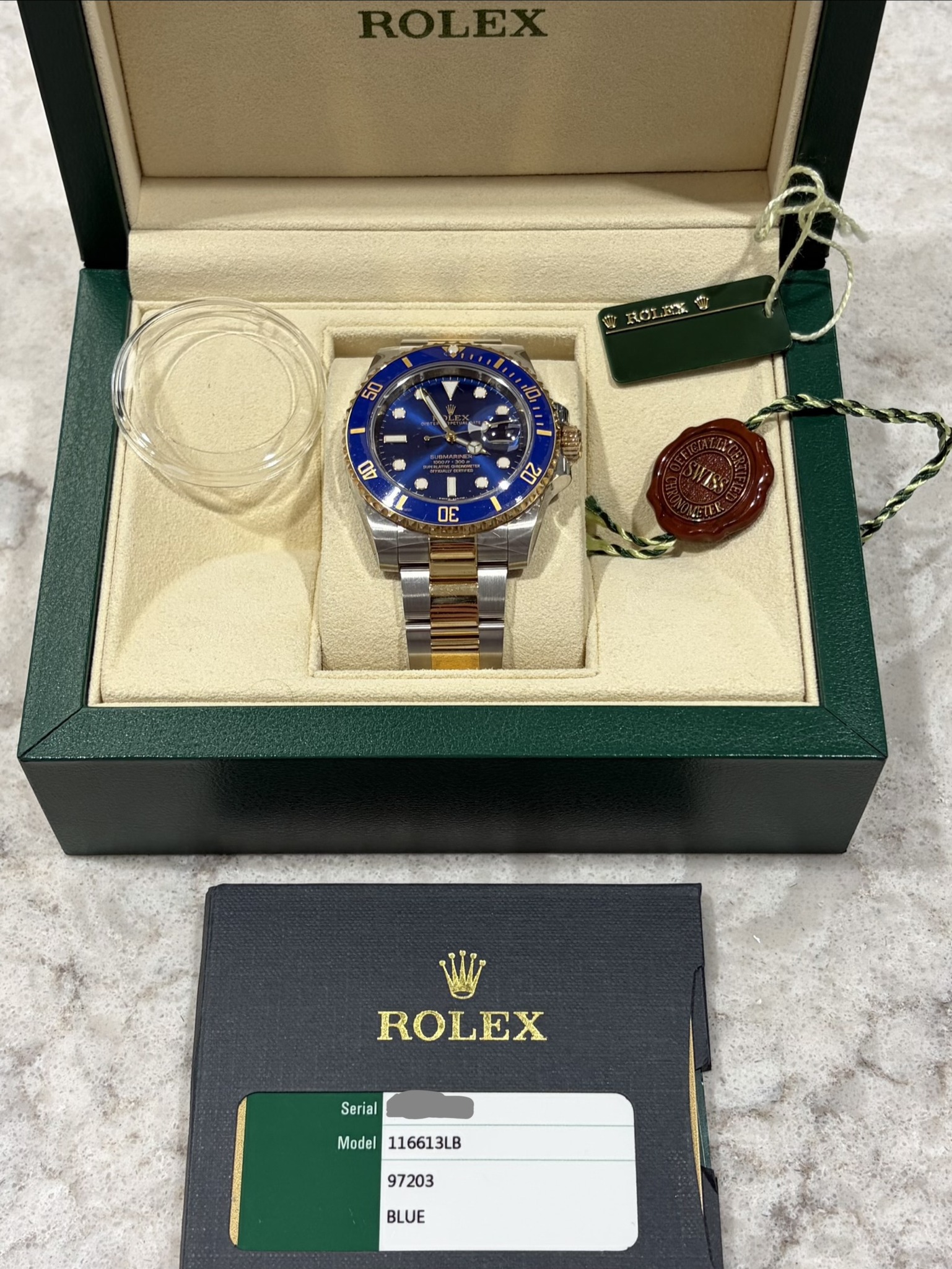 May be an image of wrist watch and text that says 'Sed 50 g D - د A NY B0 ಸು शা O0 C ROLEX Serial Model116613LB Model 116613LB 97203 BLUE'