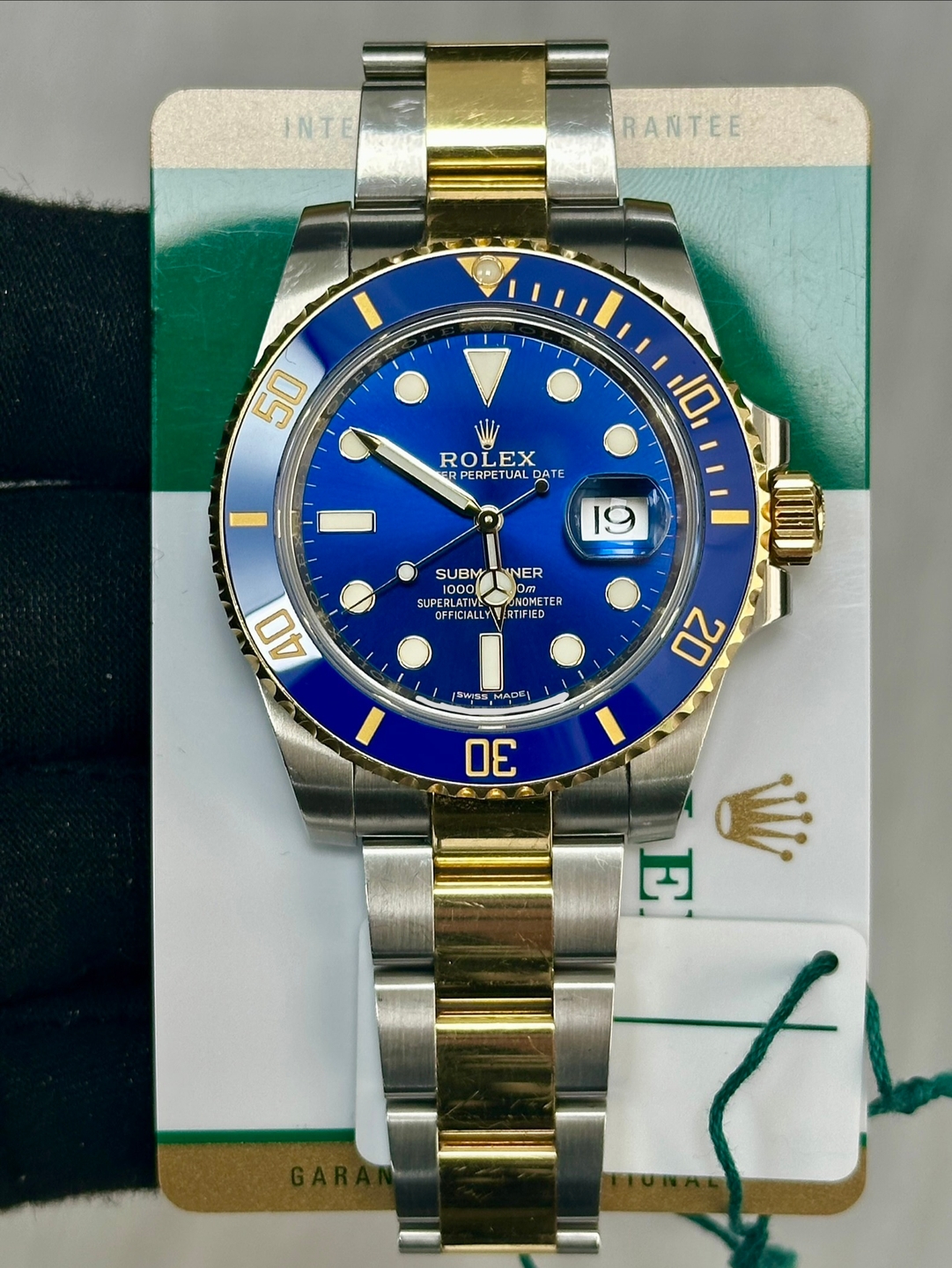 May be an image of wrist watch and text that says 'INTER INTE RANTEE 50 ROLEX PERP PERPETUA DATE ROLEX ROL EX 10 19 - SUBM SUBMTNNER NER 100 SUPERL LPEBLATI ERLAN mET…