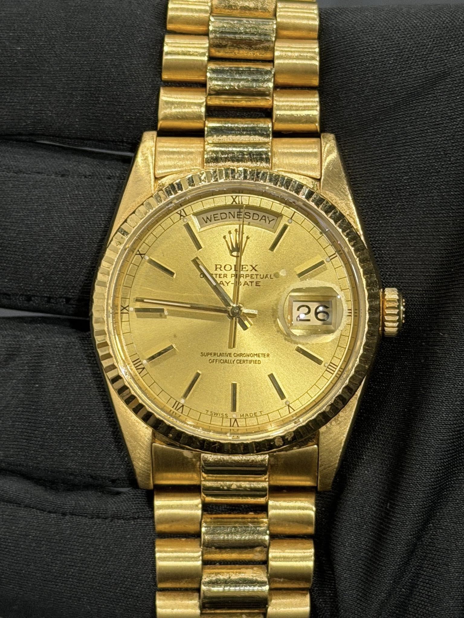 May be an image of wrist watch and text