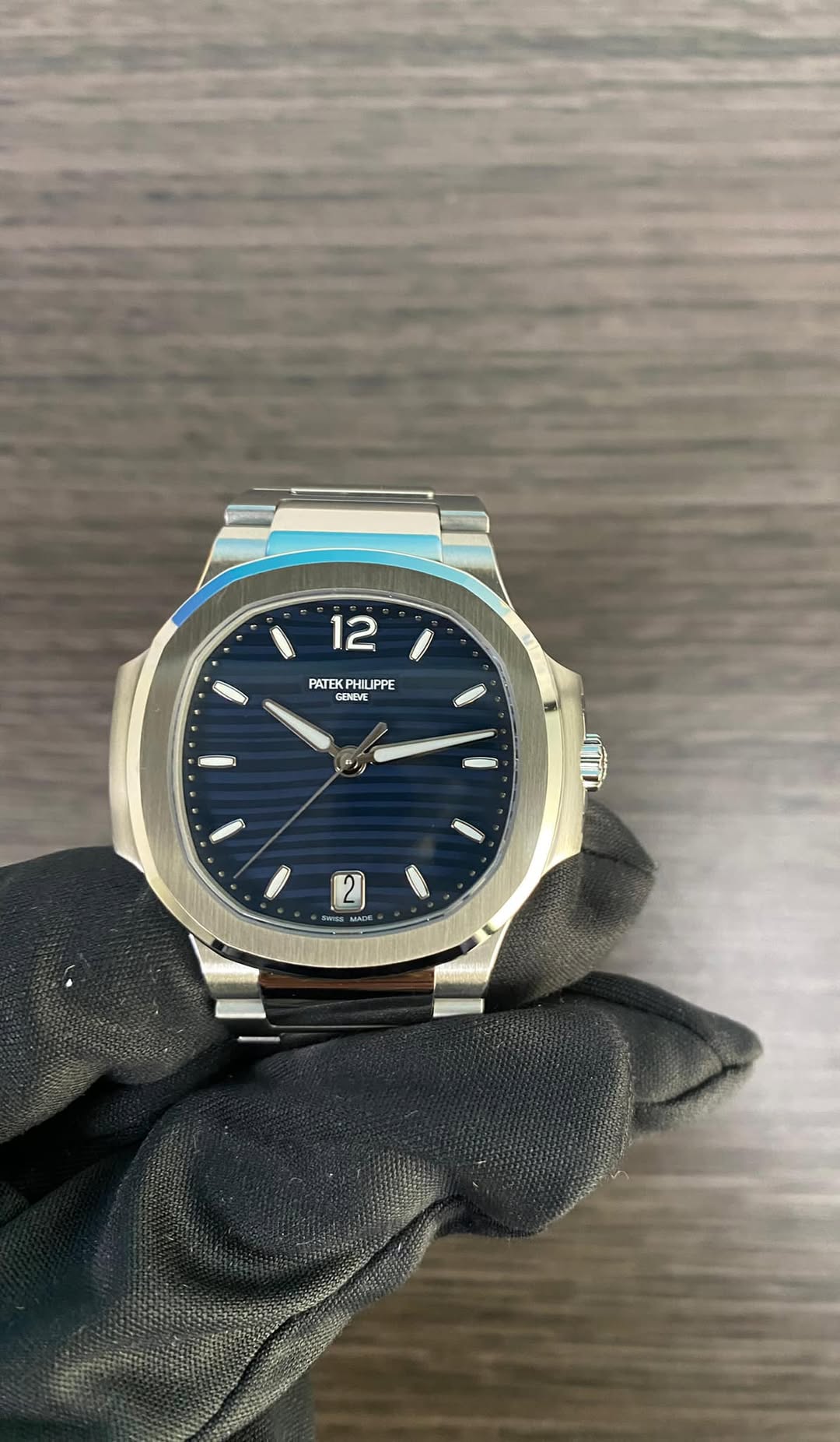 May be an image of wrist watch and text