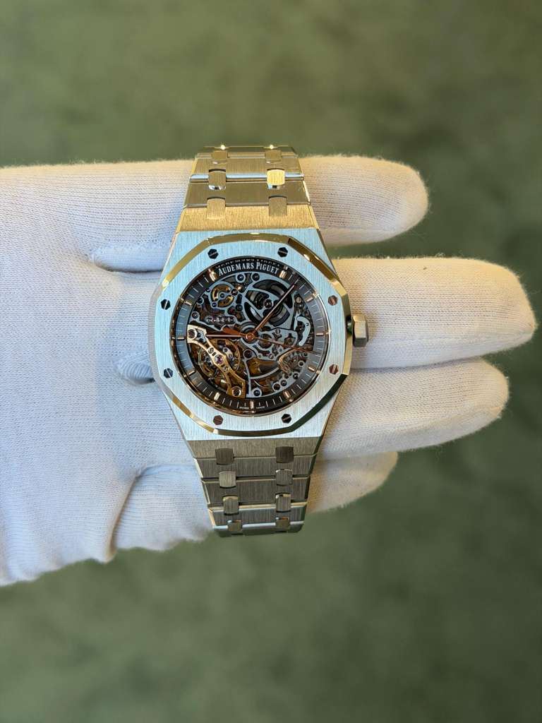 May be an image of wrist watch and text
