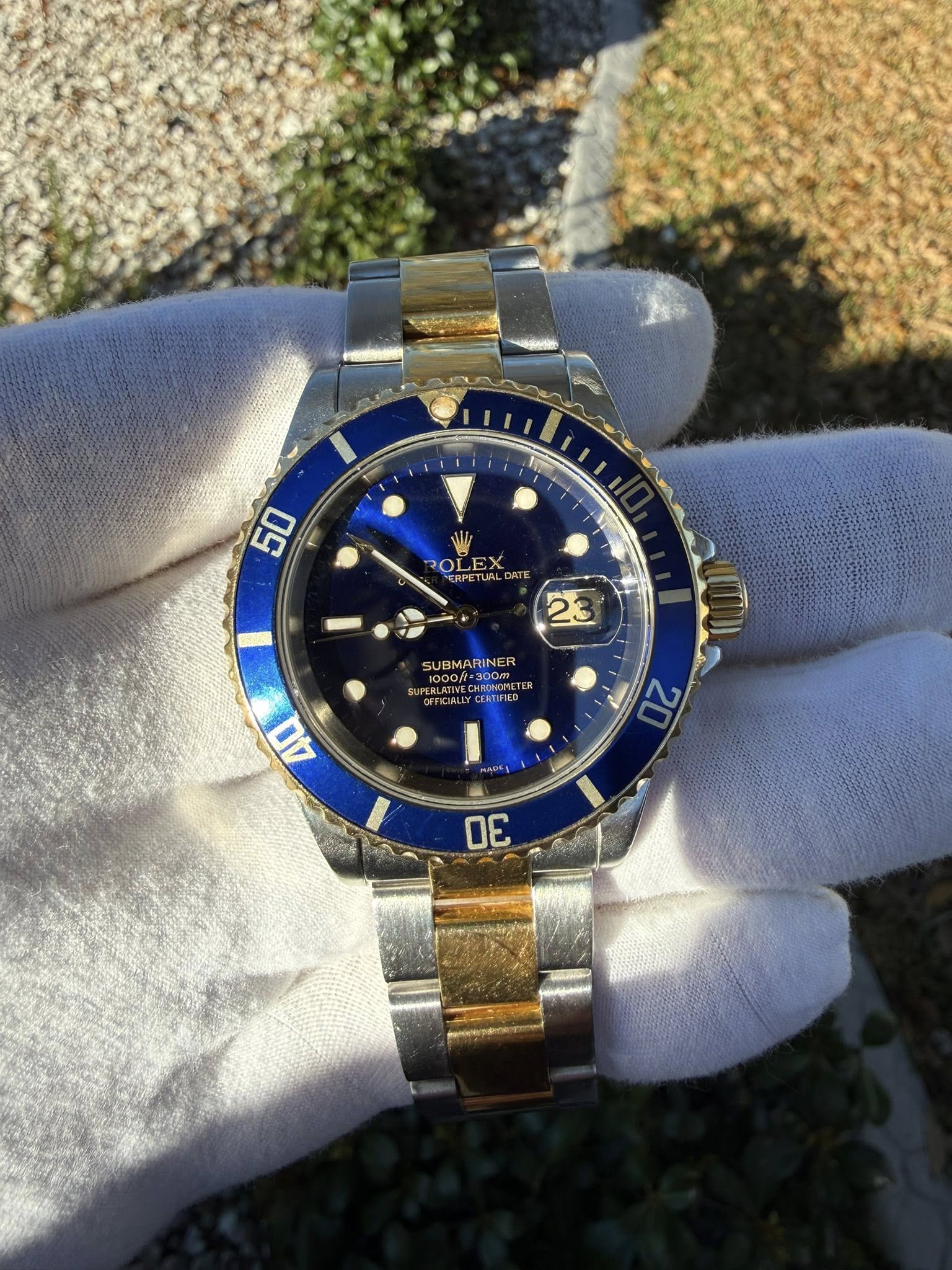 May be an image of wrist watch and text that says '50 50 ROLEX ERPETUALDA DATE 23 SUBMARINER INER 900m SUPERLAITE MDLOTVECHRONORL Δa 20 의 30'