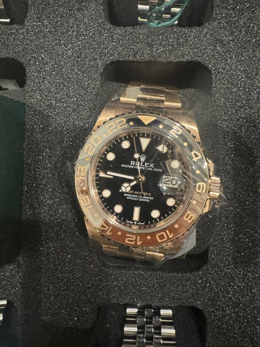 May be an image of wrist watch and text