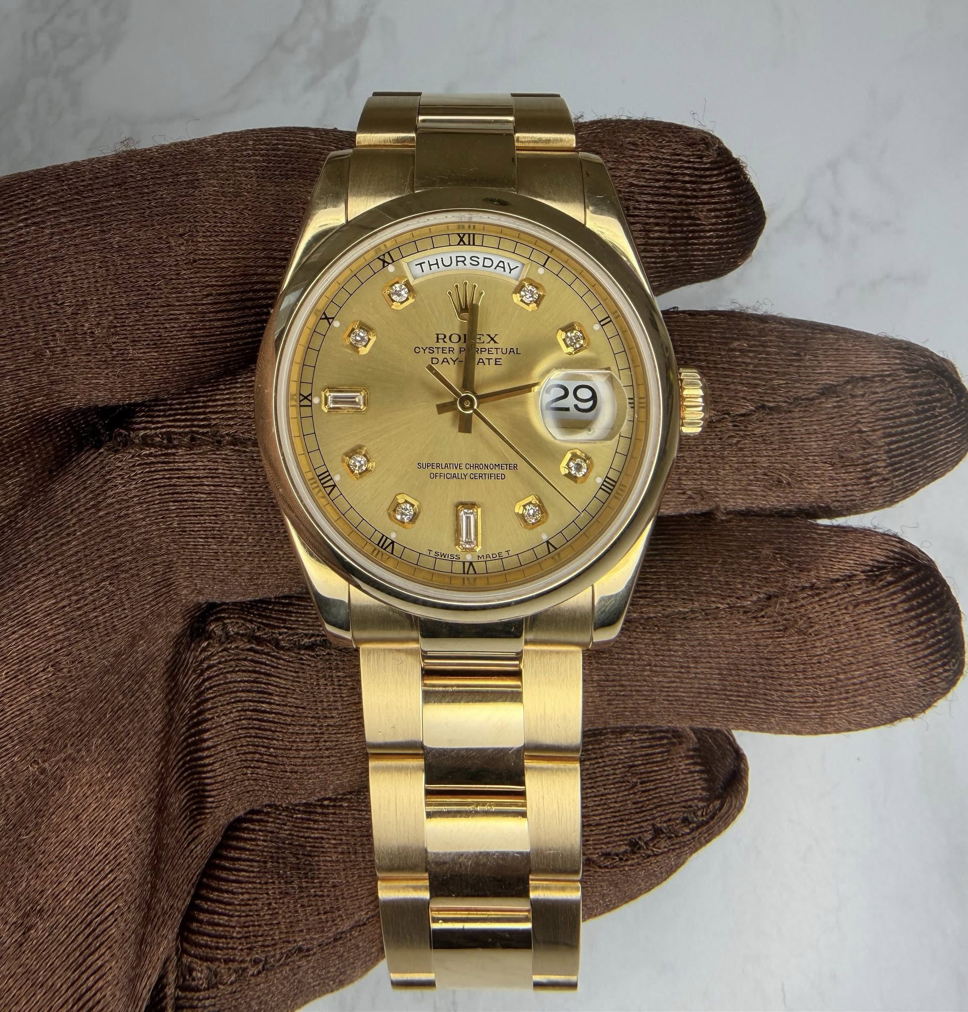 May be an image of wrist watch and text