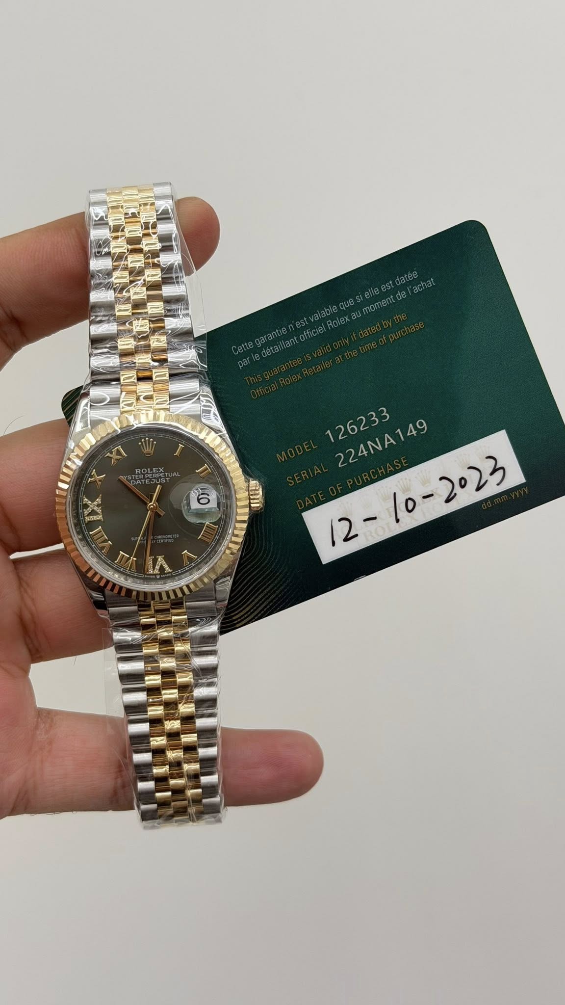 May be an image of wrist watch and text that says 'XI 6 E 川山 7 ሉ - 224NA149 224NA149 2023'