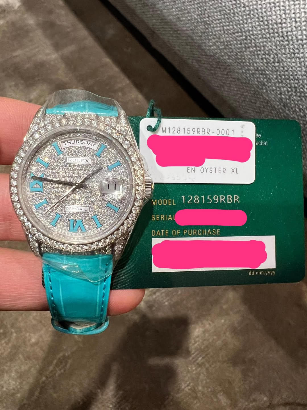 May be an image of wrist watch and text that says 'THURSDAY ရင်ခ် M128159RBR-0001 M128 ံ achat ach EN OYSTER ENOYSTERXL XL កវា 風 DAY BATE ข /01 VA T MODEL 128159RBR SERIA DATE…