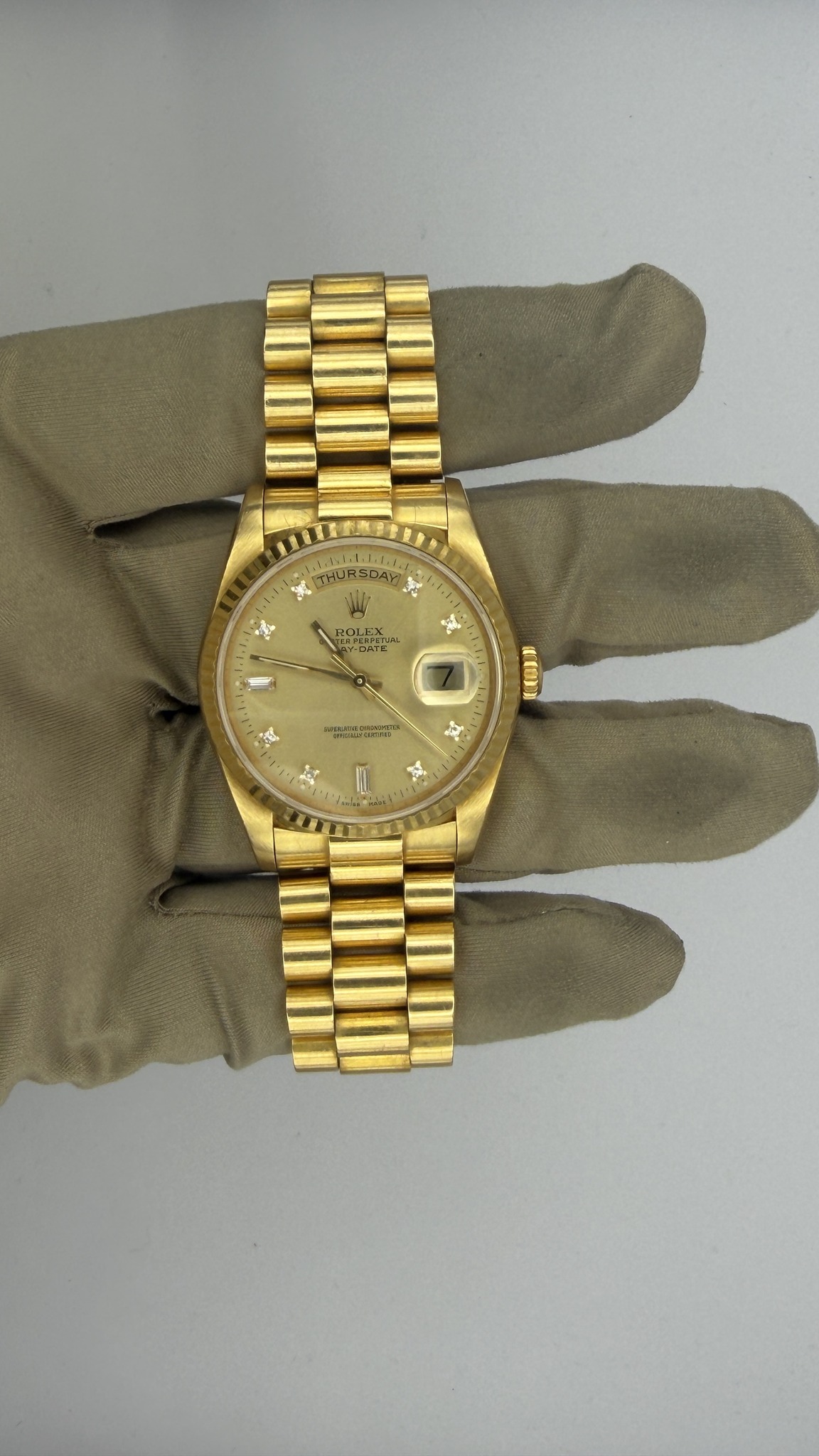 May be an image of wrist watch and text