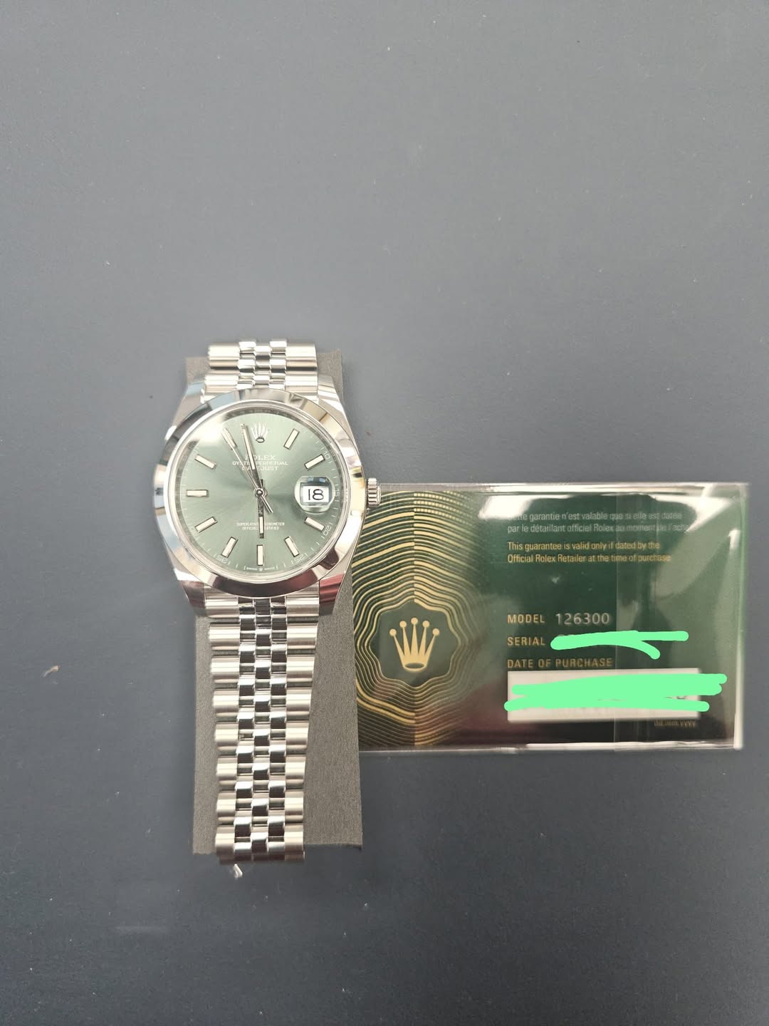 May be an image of wrist watch and text