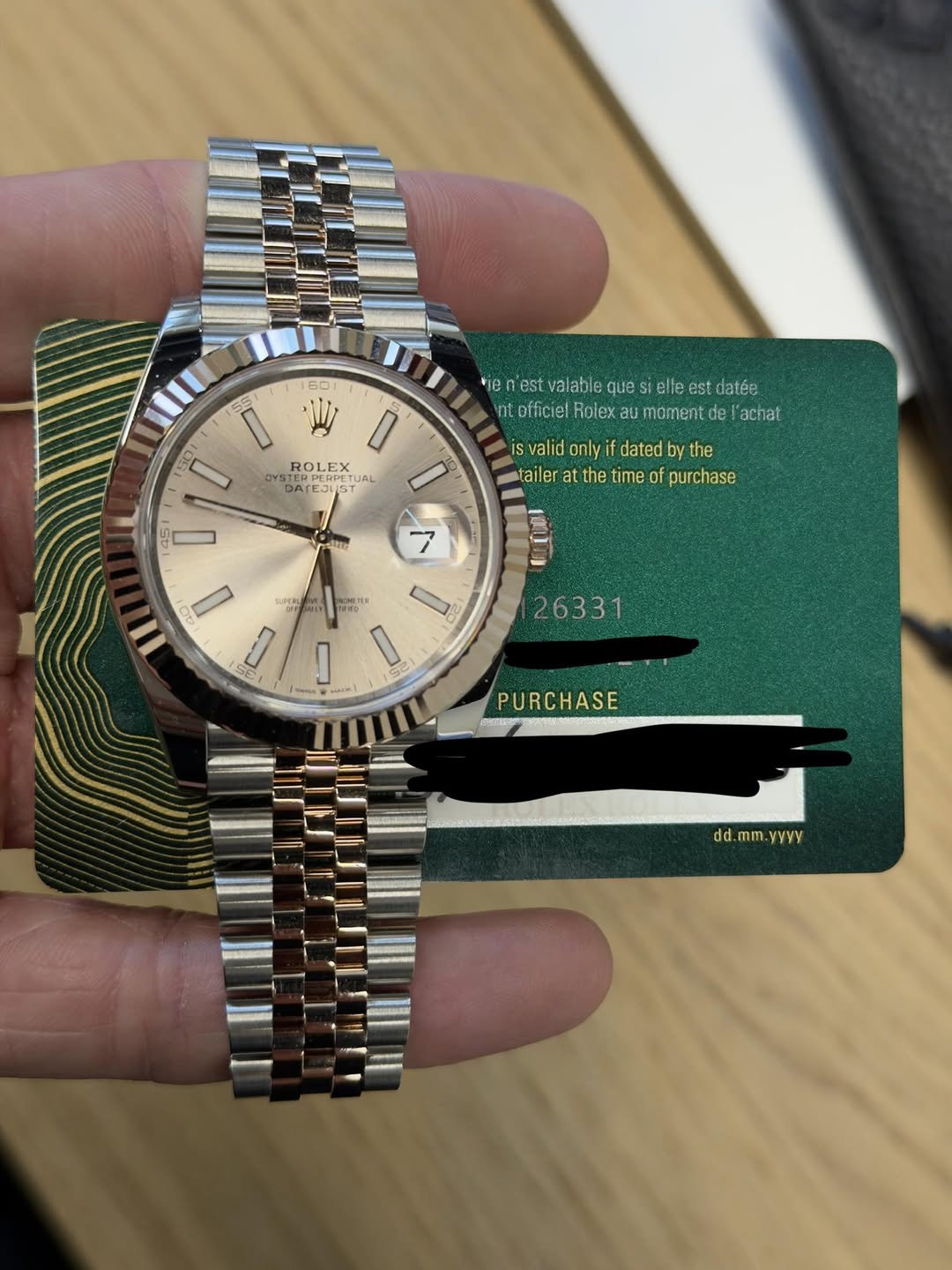 May be an image of wrist watch and text