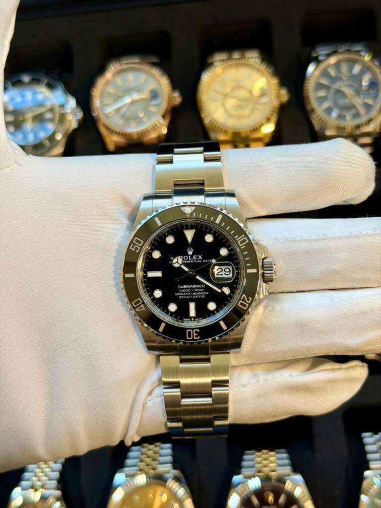 May be an image of wrist watch and text that says '50 10 RO ROLEX EX 29 SUBMARINER 40 20 I ៣'