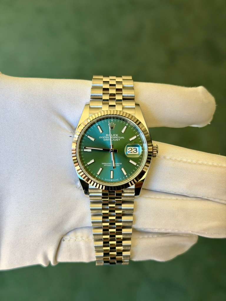 May be an image of wrist watch and text
