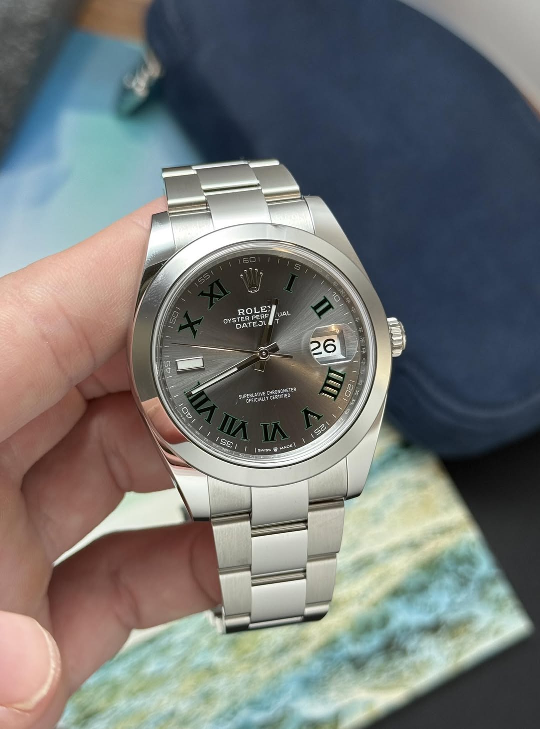 May be an image of wrist watch and text
