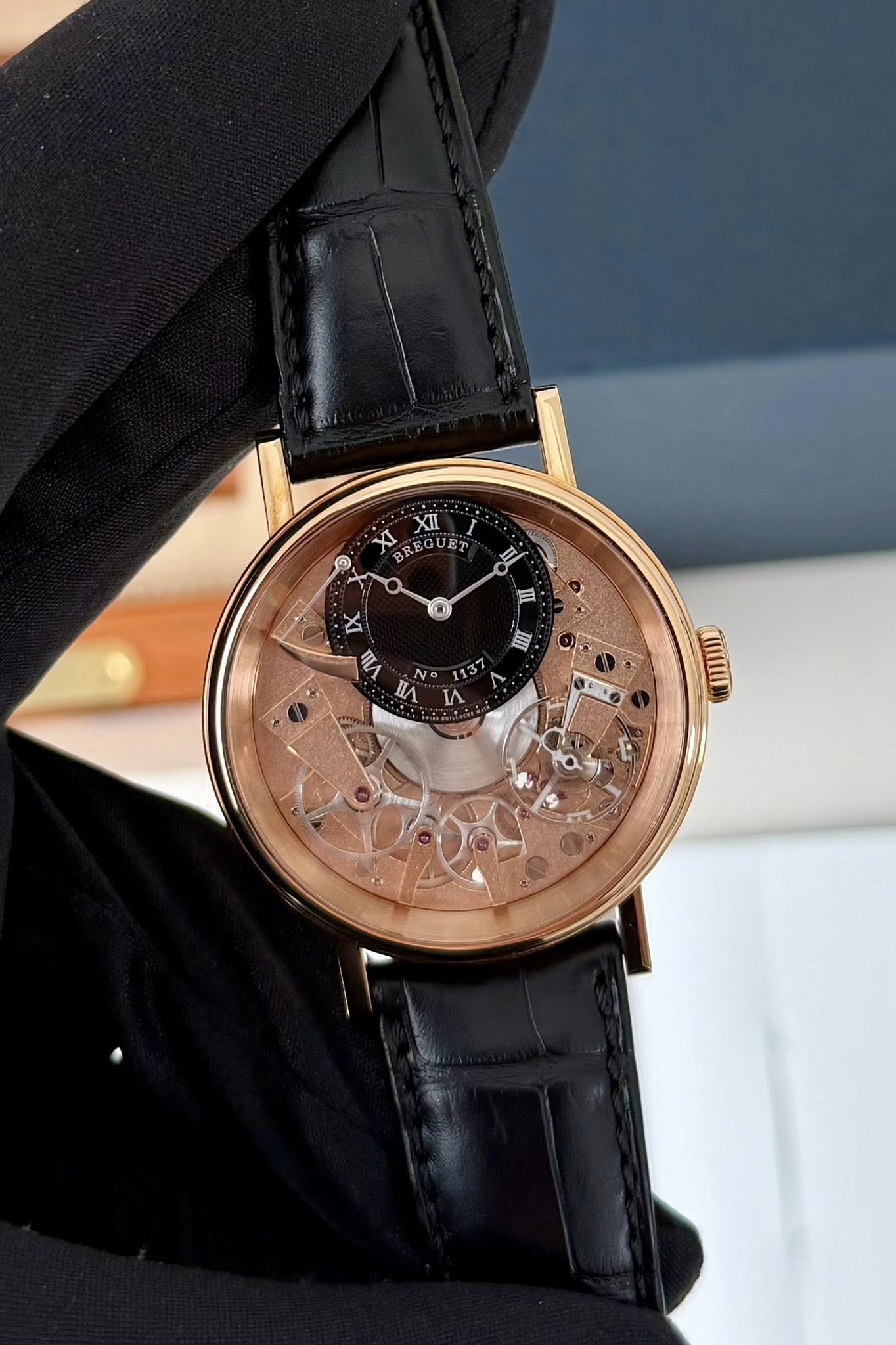 May be an image of wrist watch and text that says 'XI IXII XII 2 BREGUET 日 II ® II DK TИ N nЛ И. P'