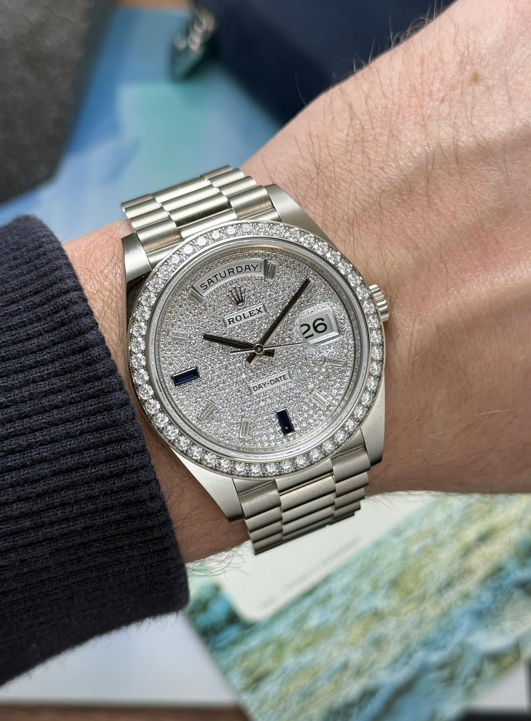May be an image of wrist watch and text that says 'SATURDAY DAY B 26'