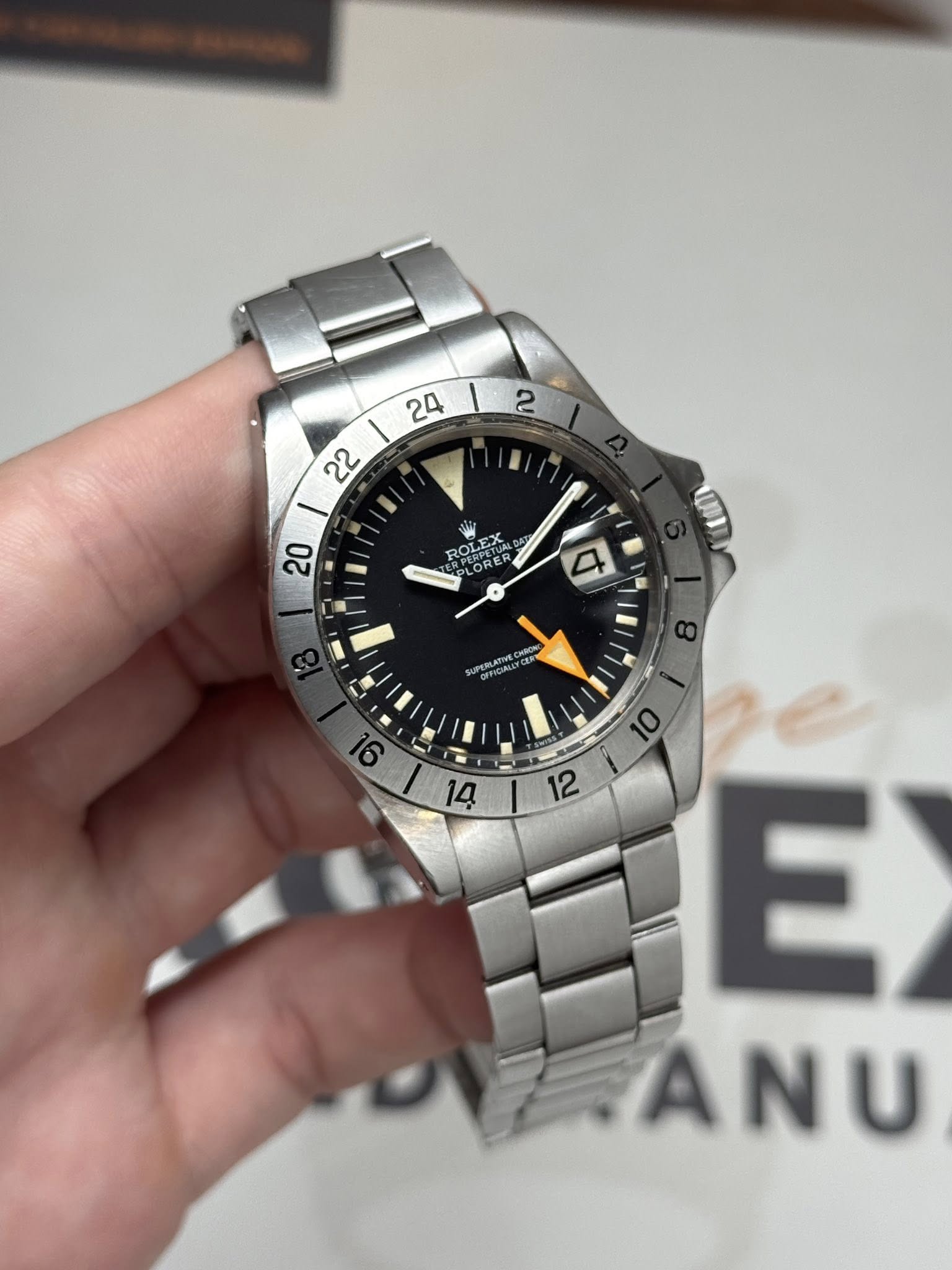 May be an image of wrist watch and text