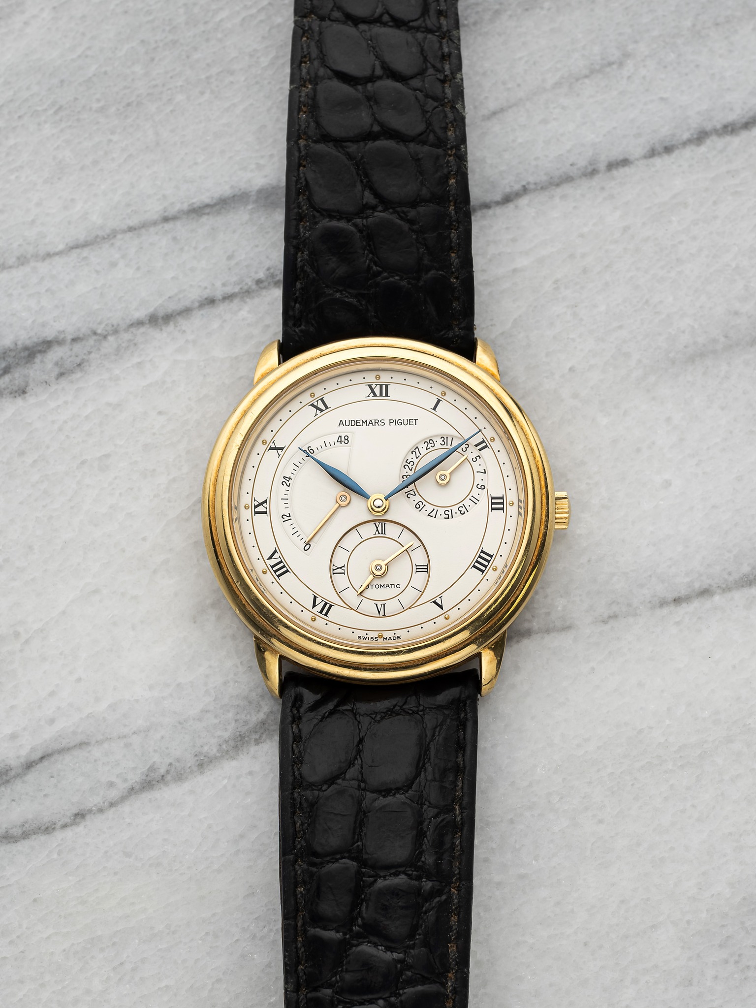 May be an image of leather, wrist watch and text