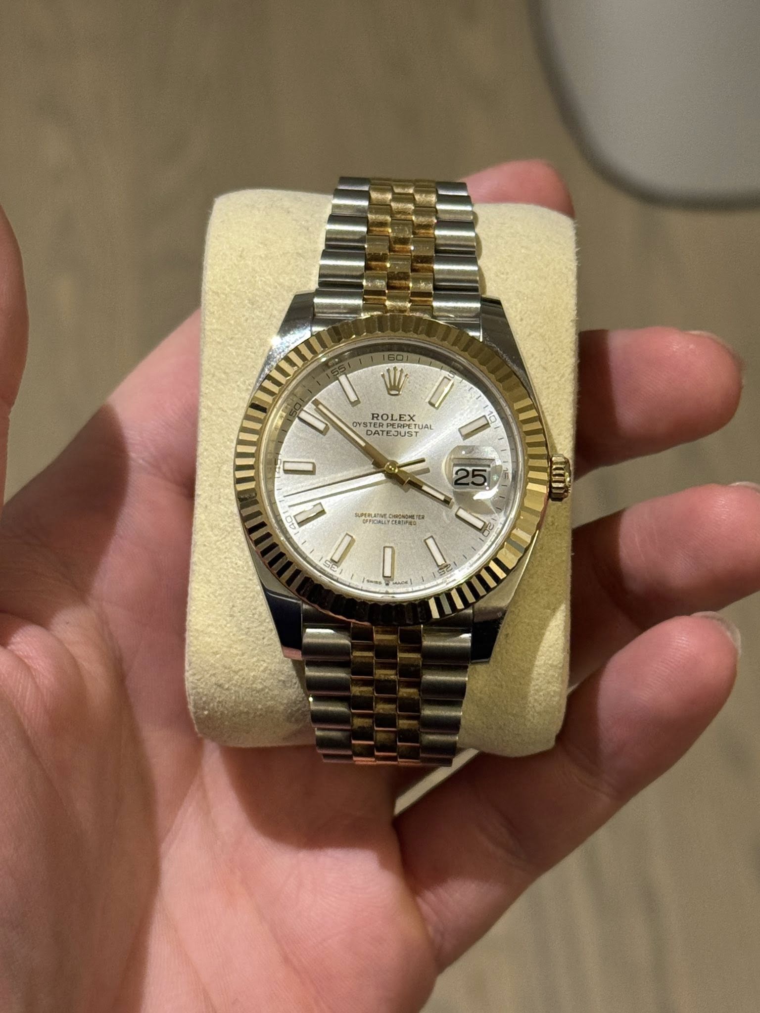 May be an image of wrist watch and text