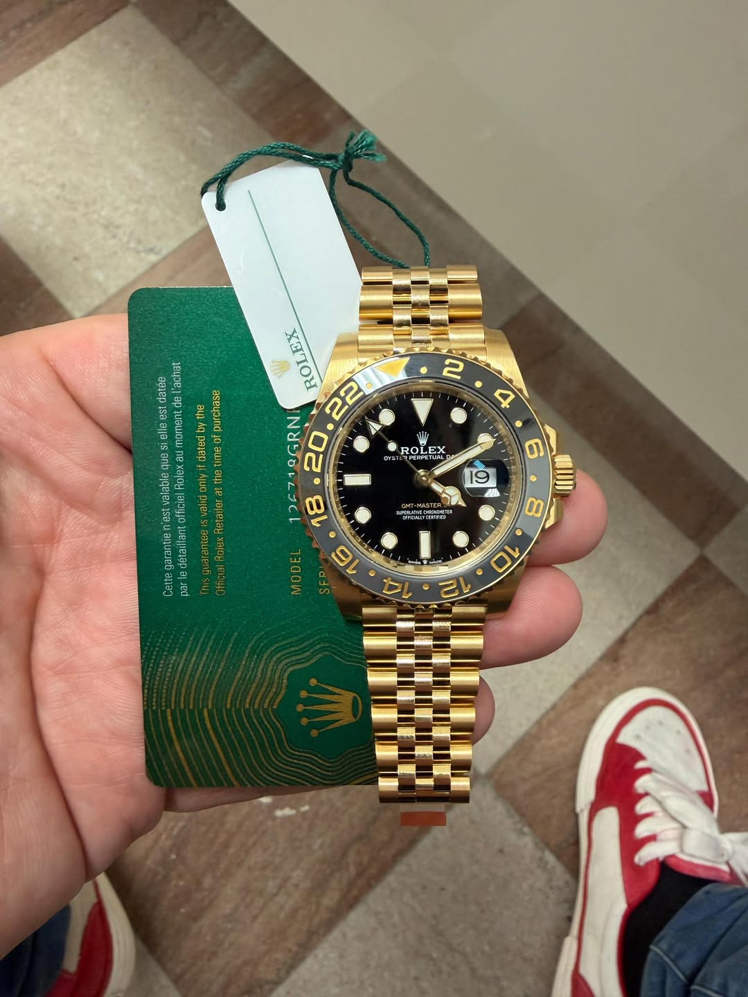 May be an image of wrist watch and text
