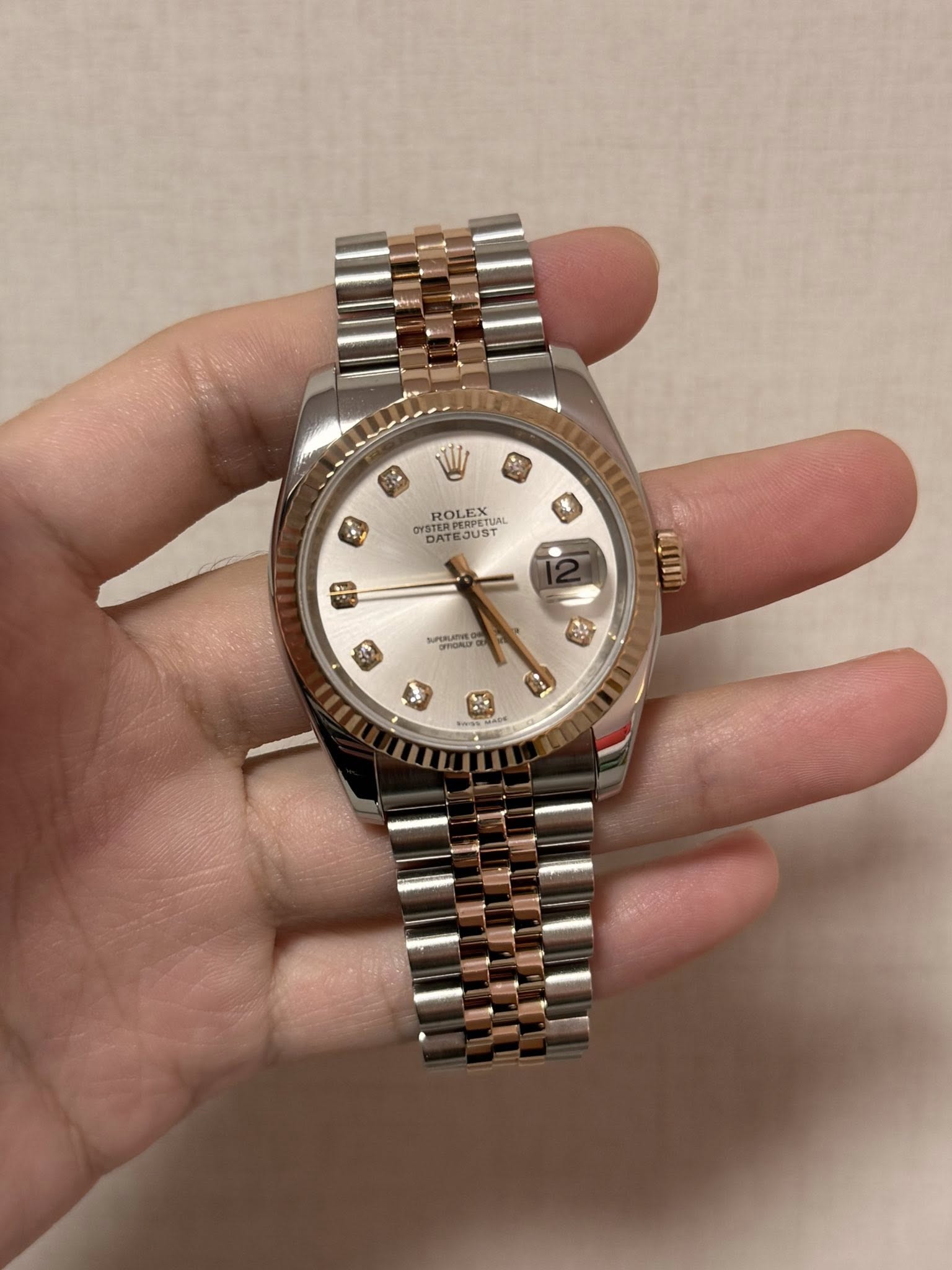 May be an image of wrist watch and text