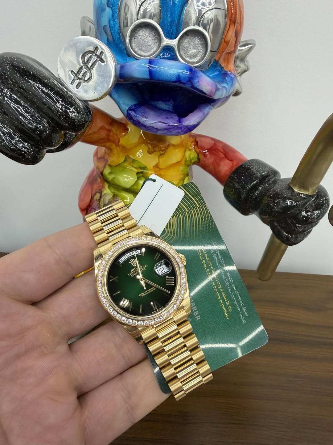 May be pop art of wrist watch, toy and text