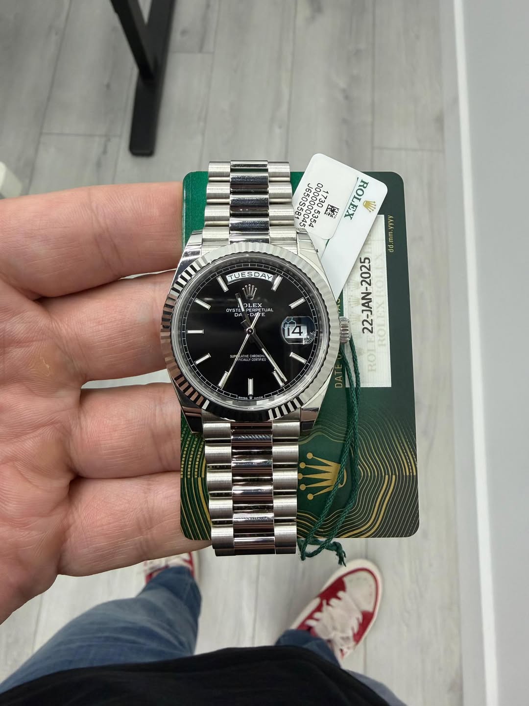 May be an image of wrist watch and text