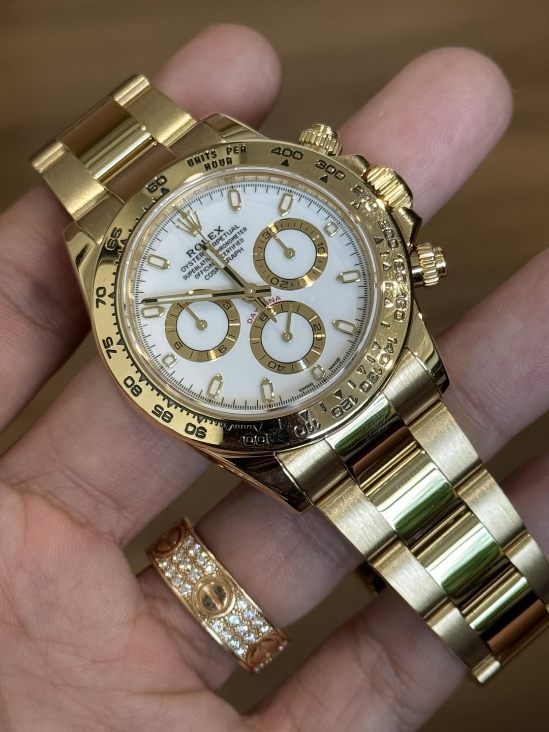 May be an image of wrist watch and text