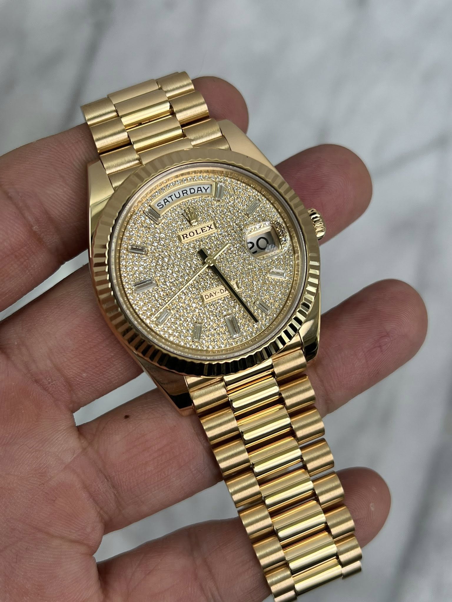 May be an image of wrist watch and text