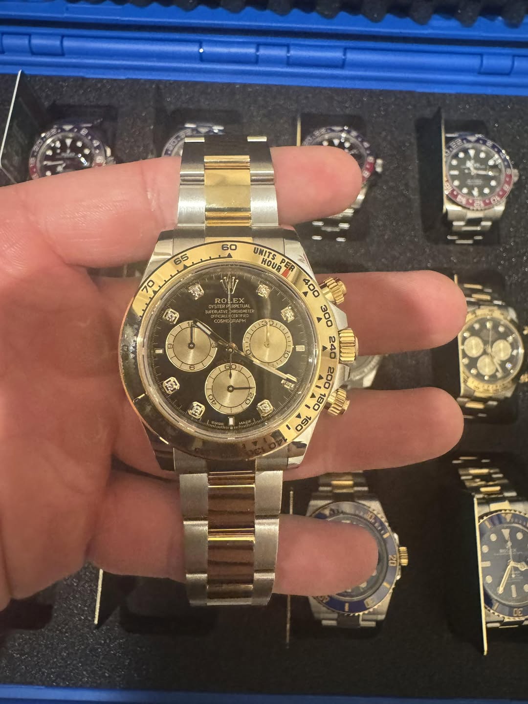 May be an image of wrist watch and text