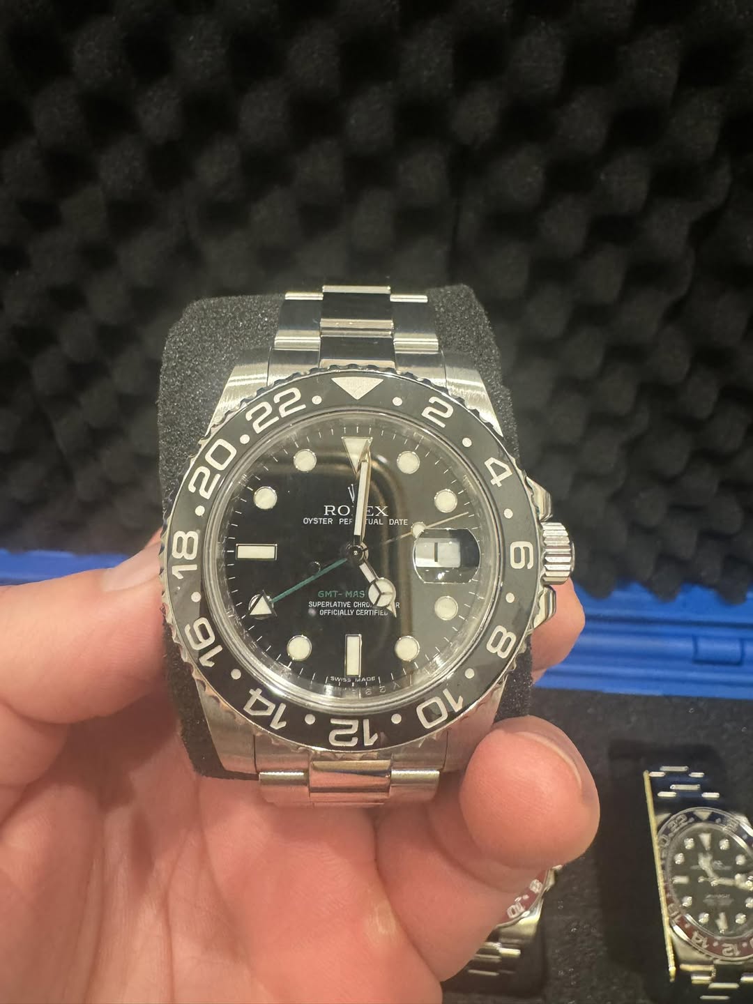 May be an image of wrist watch and text