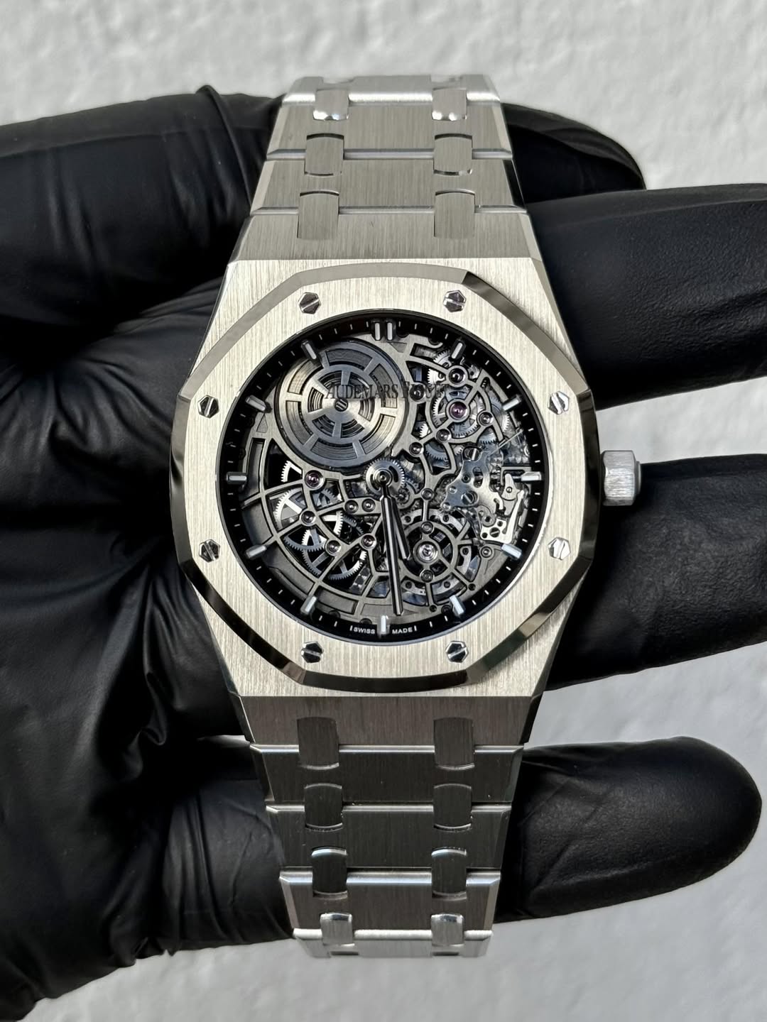 May be an image of wrist watch and text