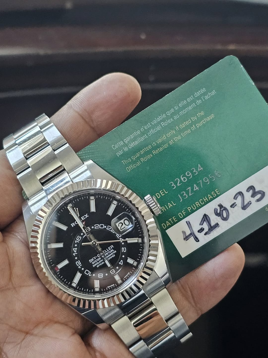 May be an image of wrist watch and text that says 'datee achat elle de que alable Rolex dated u-moment byti 'est officiel only the time of purchase the Cette garantie detaillant…