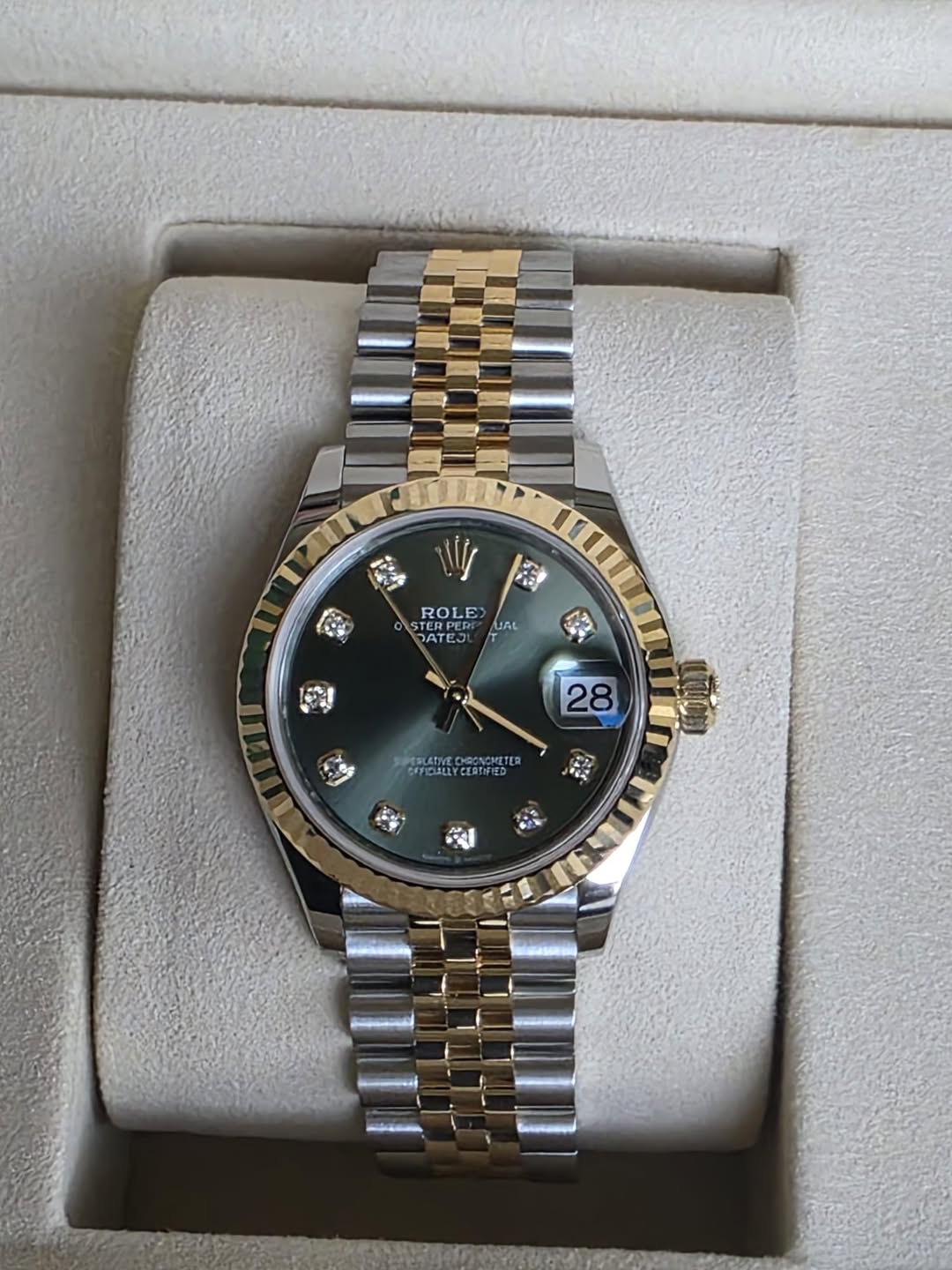 May be an image of wrist watch and text