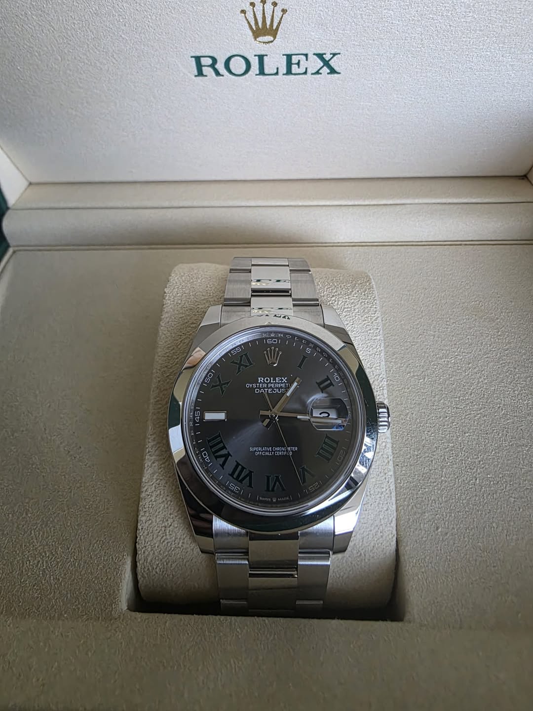 May be an image of wrist watch and text