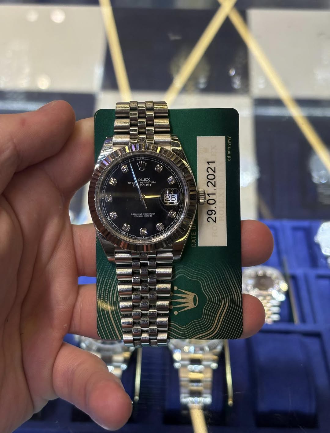 May be an image of wrist watch and text