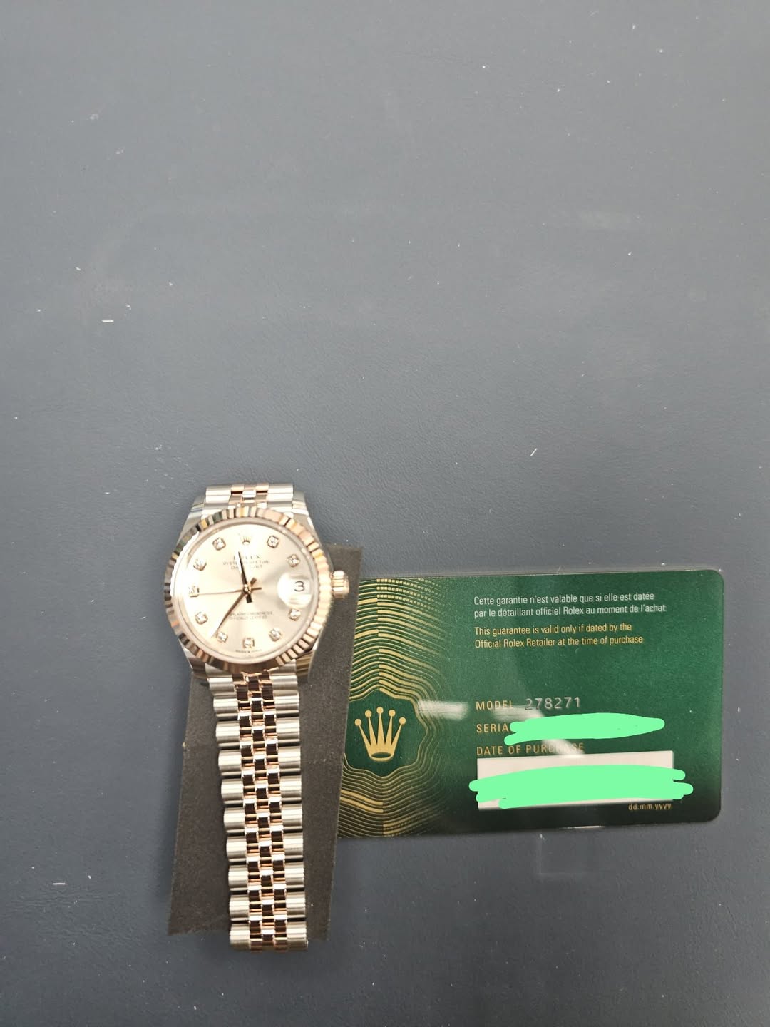 May be an image of ticket stub, wrist watch and text