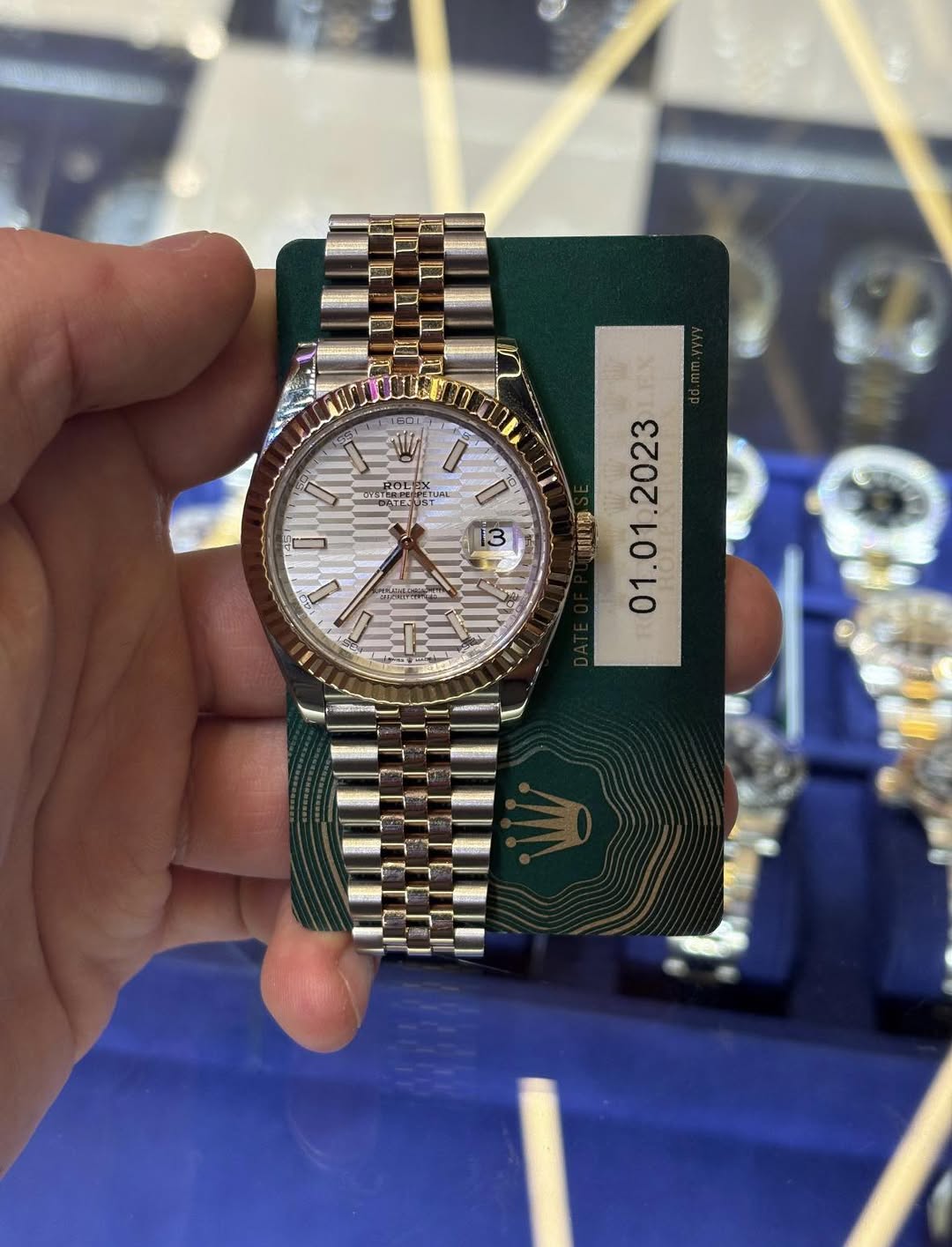May be an image of wrist watch and text
