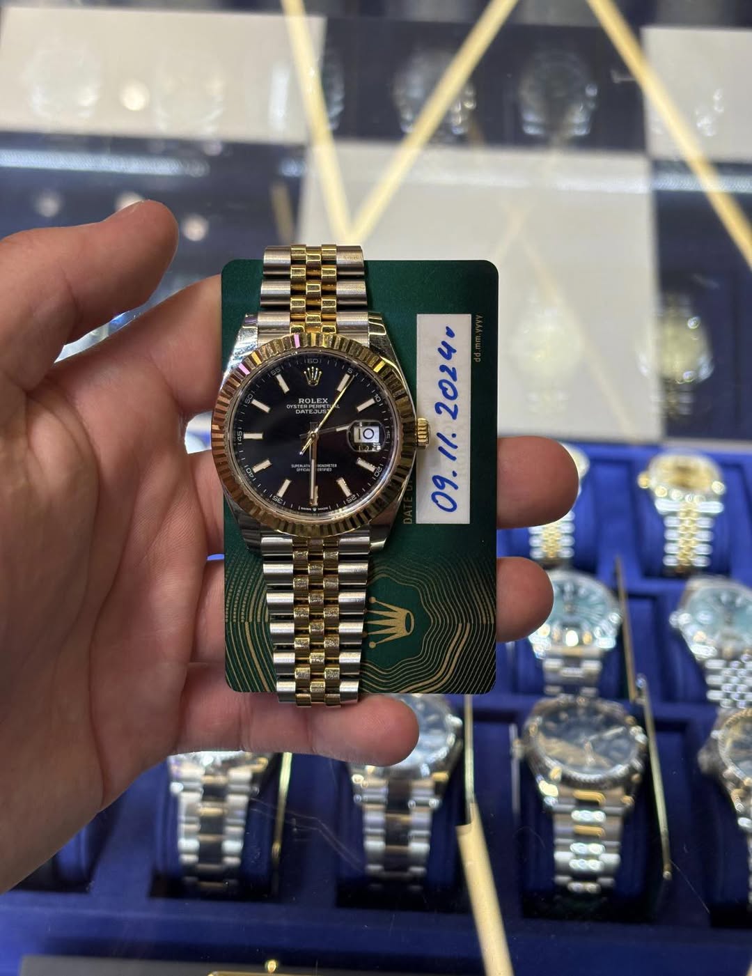 May be an image of wrist watch and text