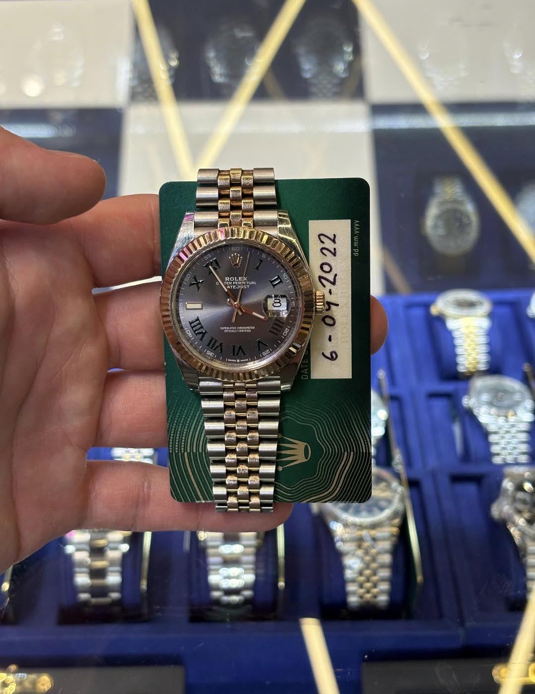May be an image of wrist watch and text