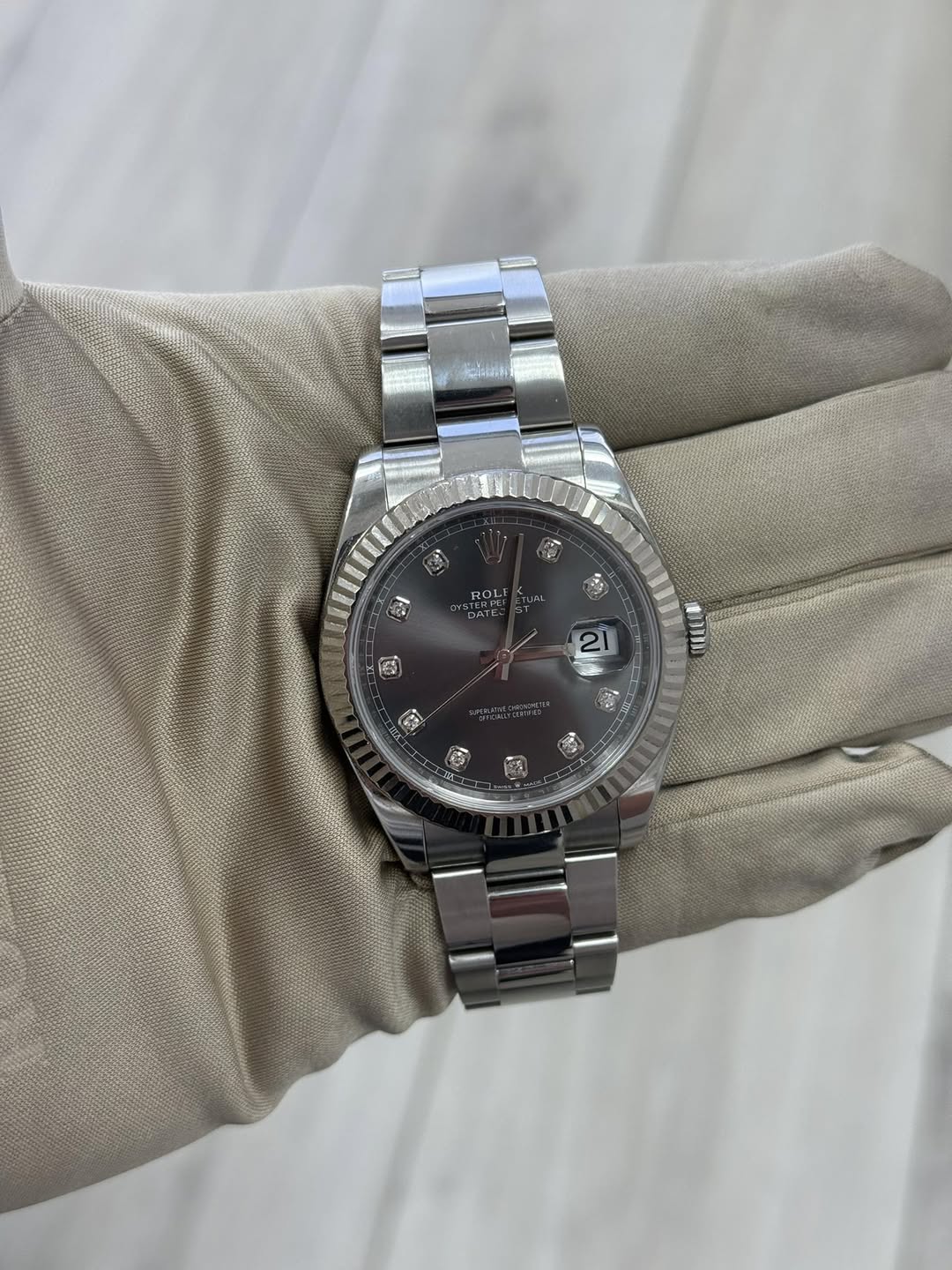 May be an image of wrist watch and text